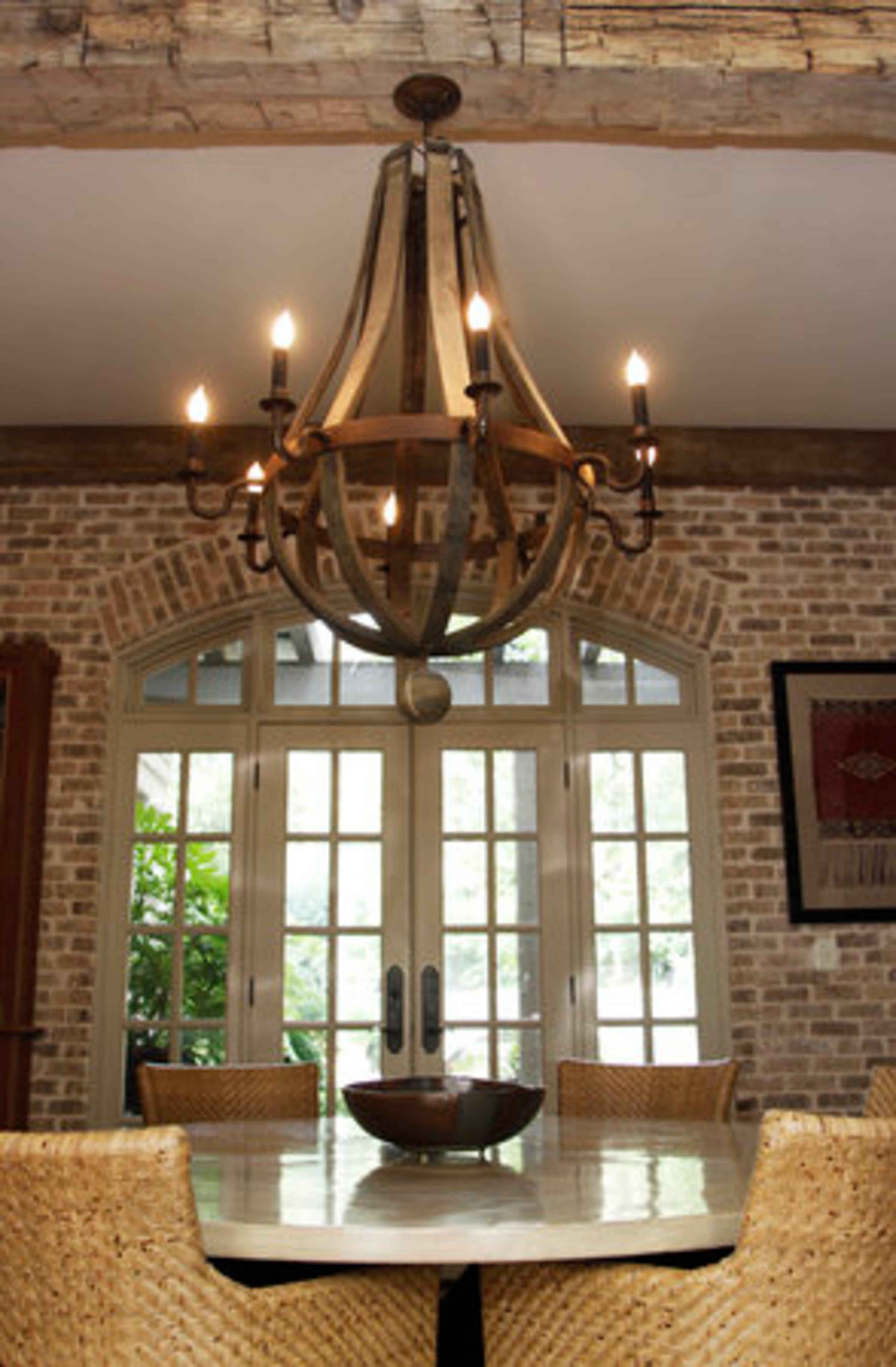 Builder Michael Ladisic of Ladisic Fine Homes used beams reclaimed from an old farmhouse in Pennsylvania's Amish country across the back of the house.