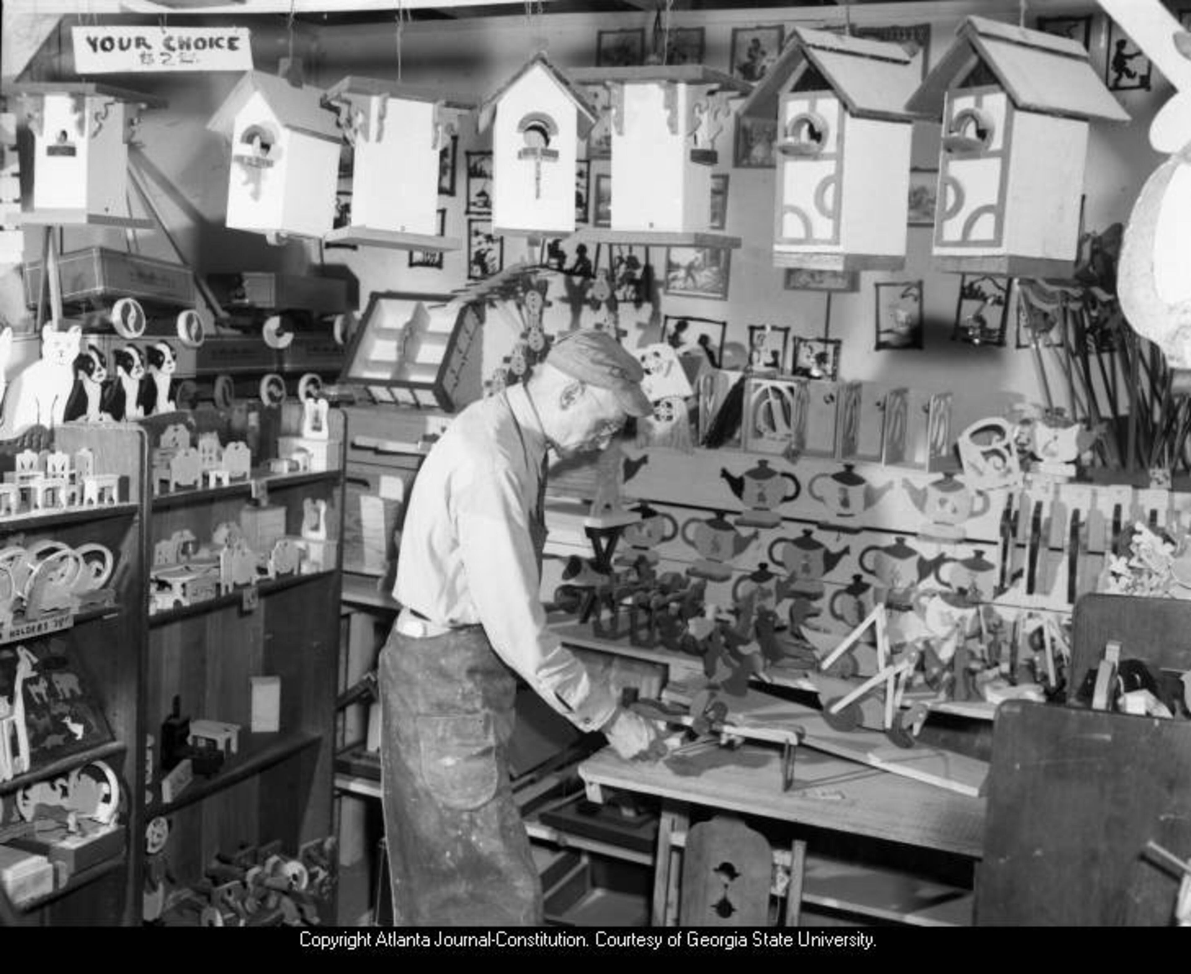 Dec. 15, 1946 -- Rows of wooden toys line a toymaker's studio. CAROLYN MCKENZIE CARTER / AJC PHOTO ARCHIVES