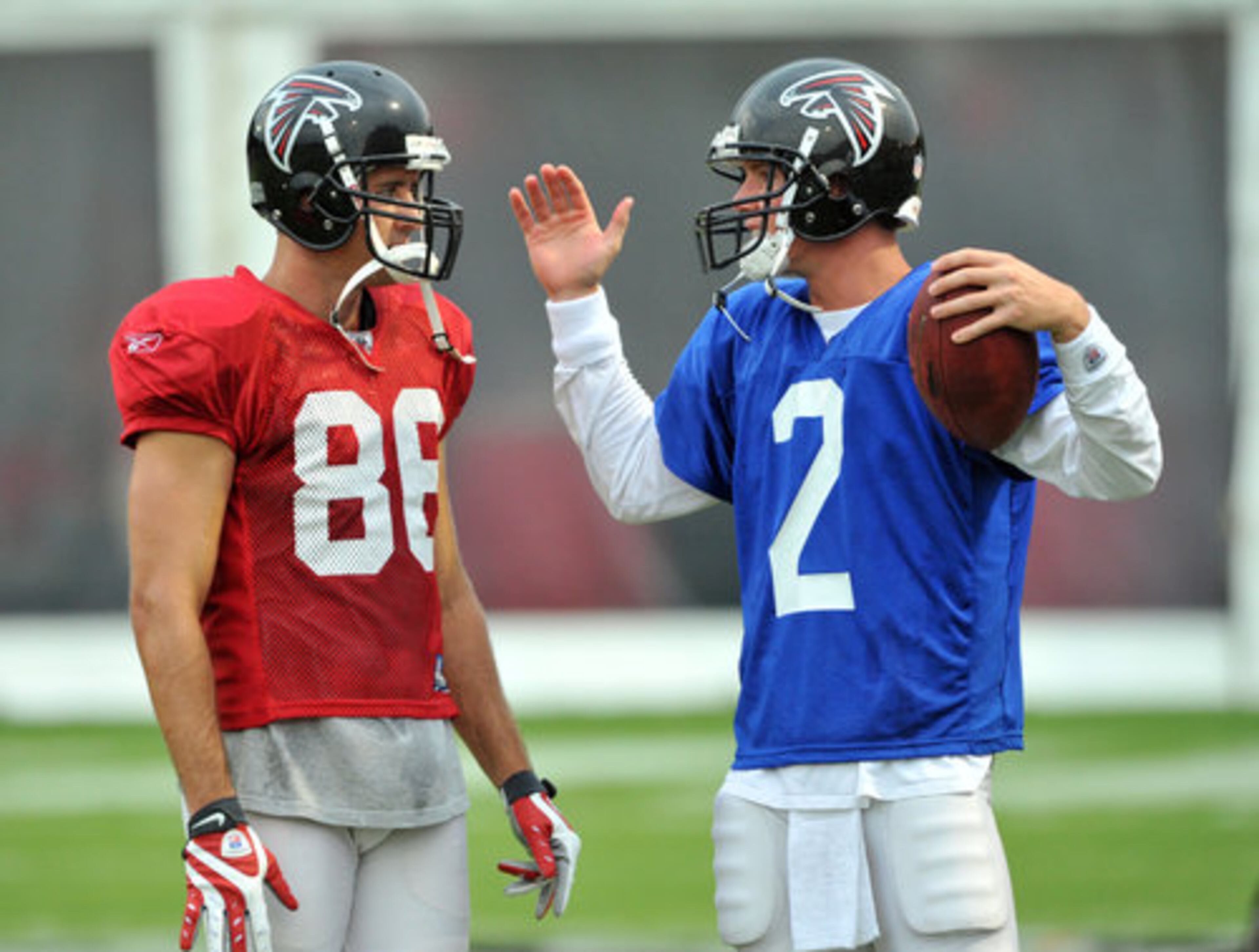 Atlanta Falcons' Matt Ryan (2) chats with Brian Finneran (86) during the Friday Night Lights at North Gwinnett High School in Suwanee.