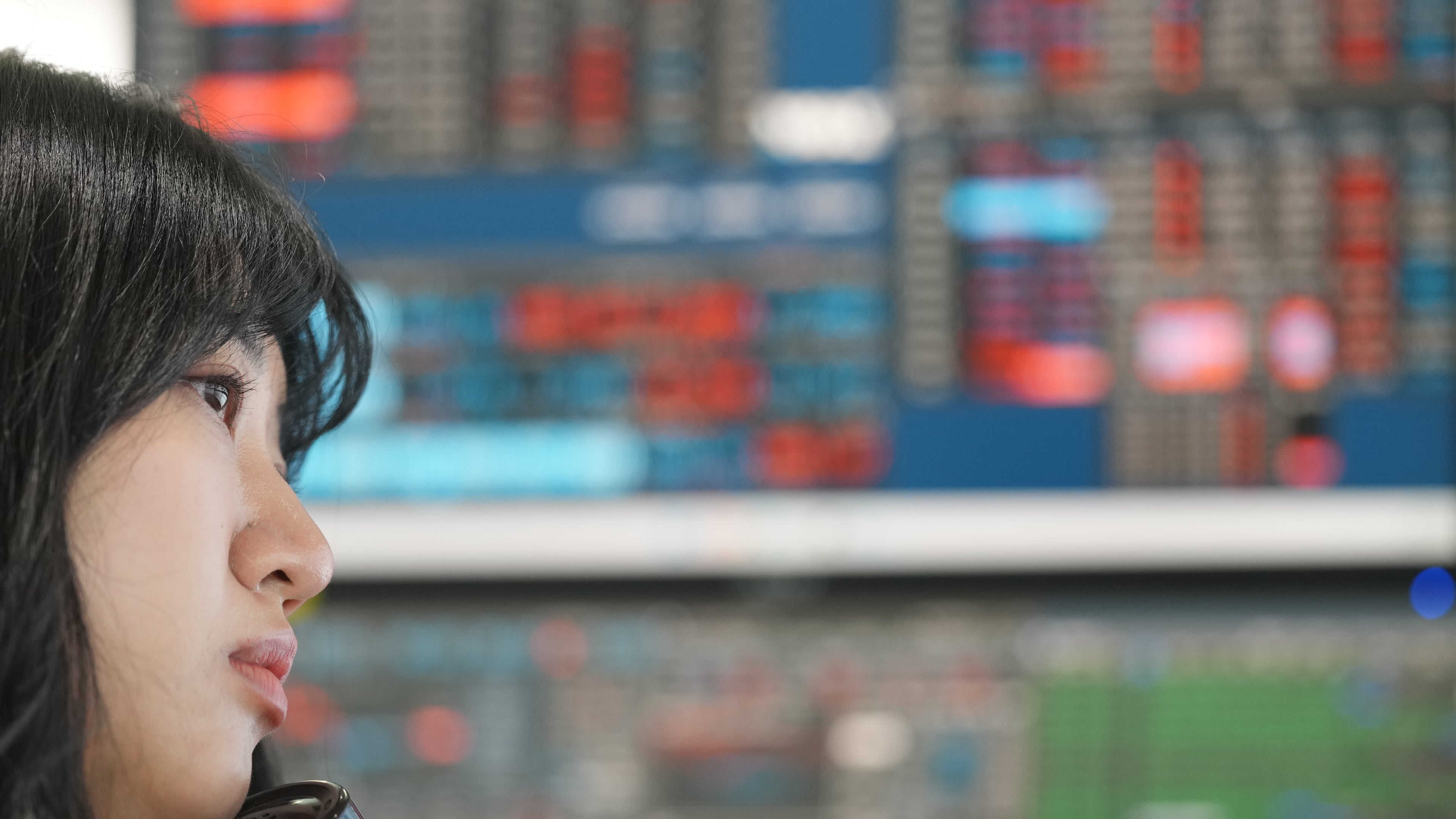 A dealer talks on the phone at a dealing room of Hana Bank in Seoul, South Korea, Wednesday, May 13, 2026. (AP Photo/Lee Jin-man)