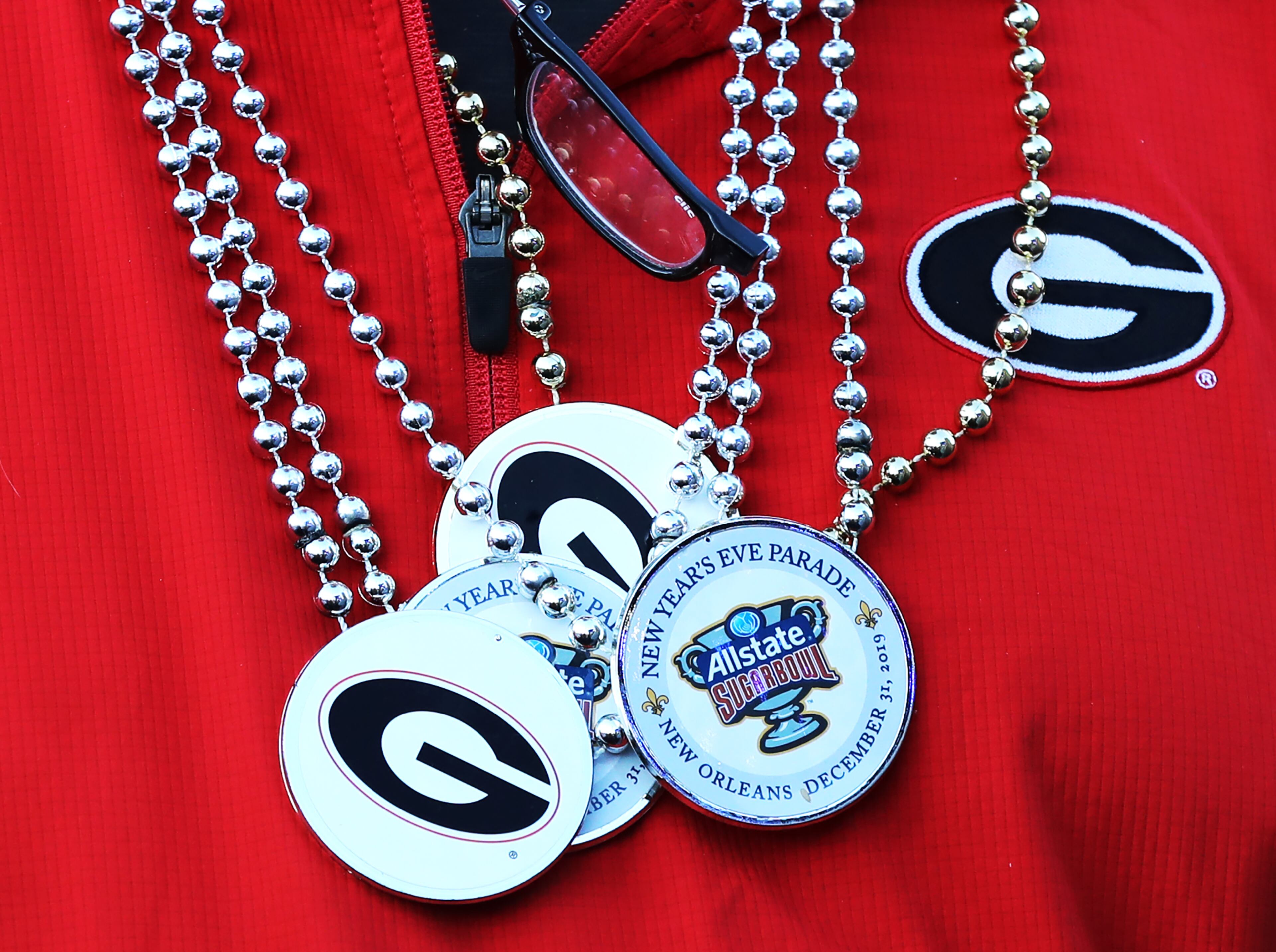 A Georgia fan sports some beads from the Sugar Bowl New Year's Eve Parade. Curtis Compton ccompton@ajc.com