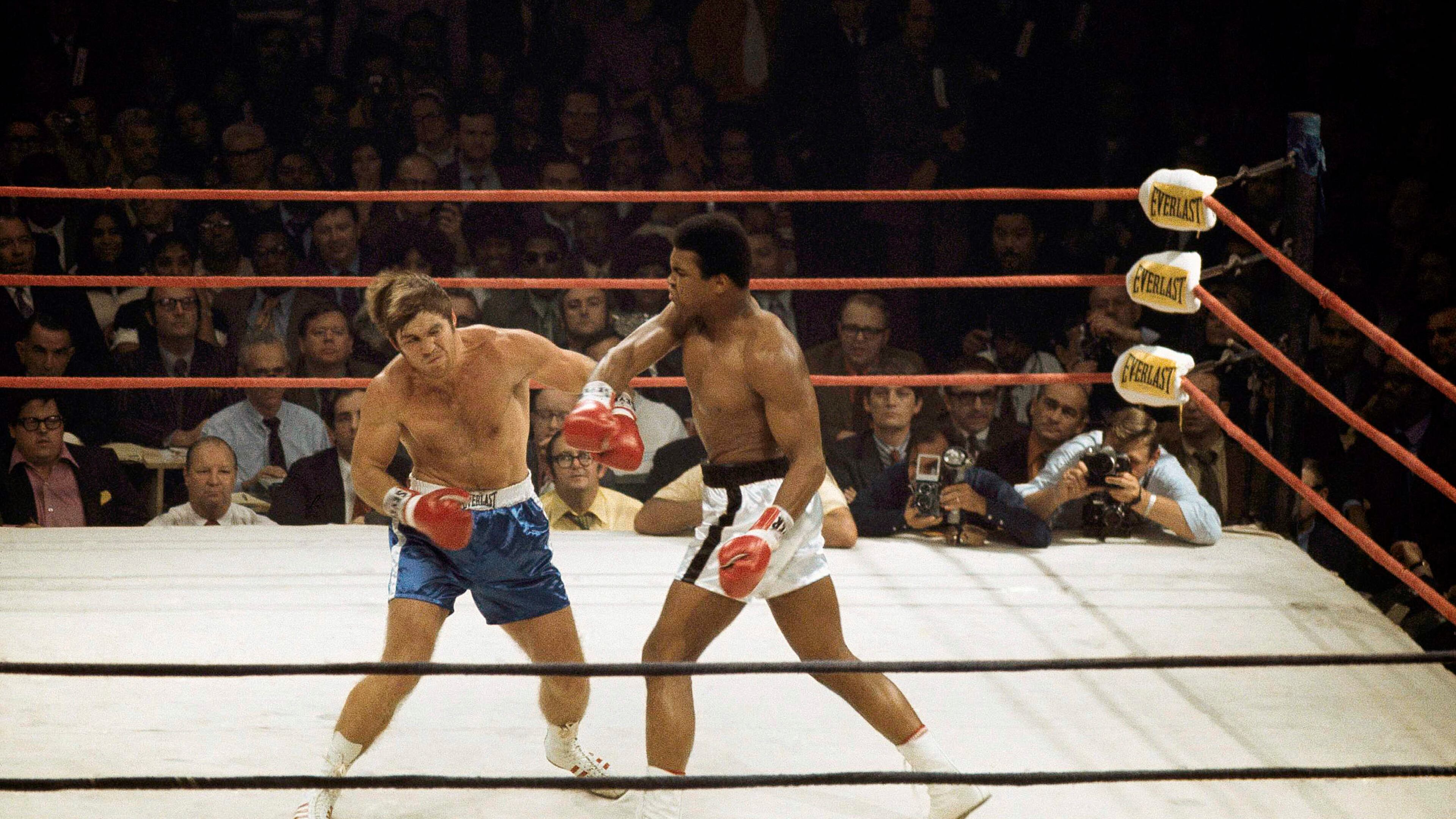 Muhammad Ali delivers a hard right to Jerry Quarry on Oct. 26, 1970, in a scheduled 15 round fight at the Atlanta Municipal Auditorium in Atlanta. Ali was declared the winner after Quarry didn't answer the bell for the fourth round. Quarry had a gash over his left eye that required 11 stitches to close. (AP Photo/Joe Holloway Jr.)