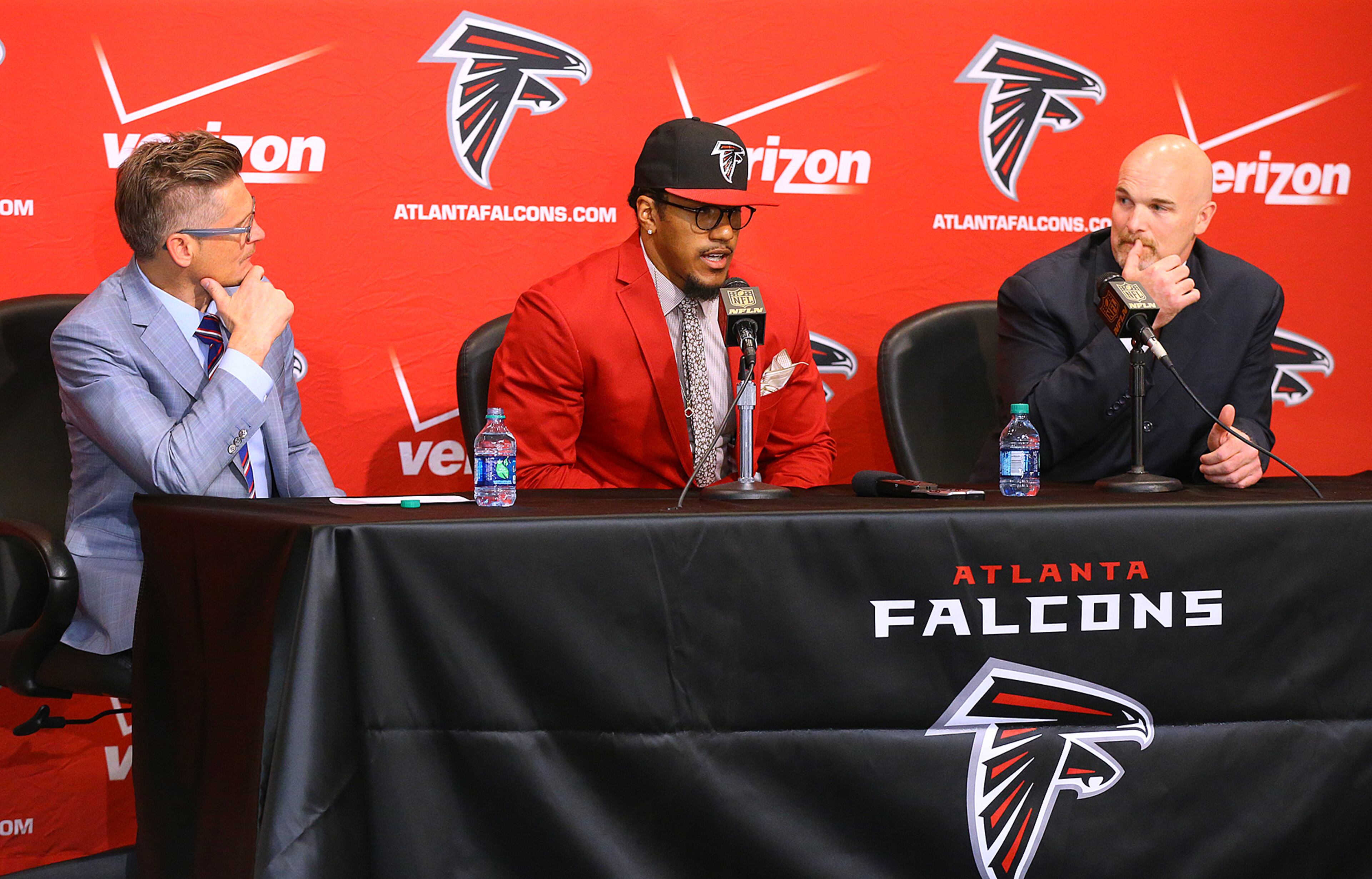 Falcons General Manager Thomas Dimitroff (left) and head coach Dan Quinn look on as first-round draft pick Vic Beasley takes questions from the media during his press conference at the Falcons training facility on Friday, May 1, 2015, in Flowery Branch. Beasley, who was the 8th overall pick in the NFL draft, is Clemson's sack leader. Curtis Compton / ccompton@ajc.com