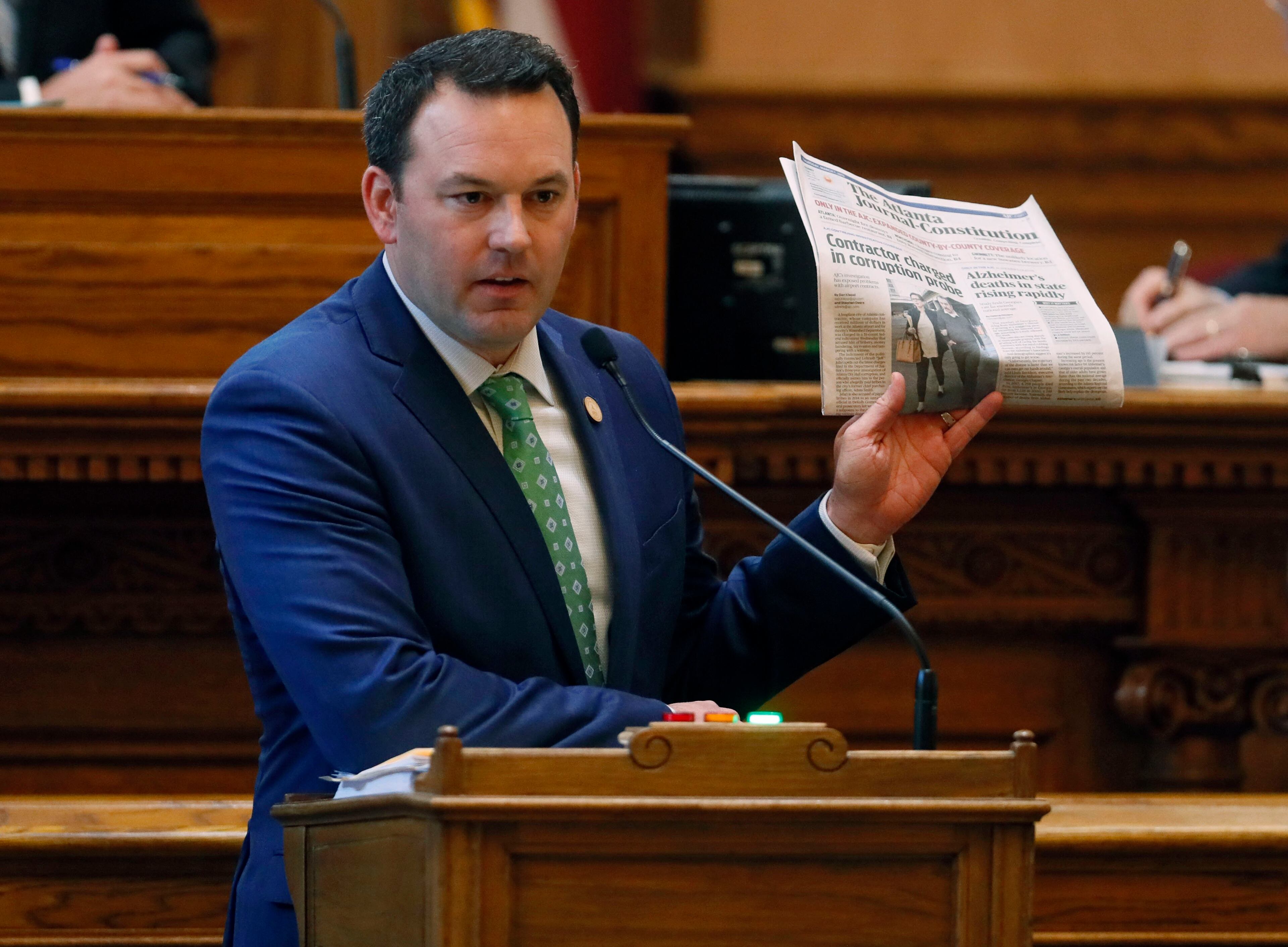 March 7, 2019 - Atlanta - The sponsor, state Sen. Burt Jones, made his case for his bill to give the state control of Hartsfield-Jackson airport as he unfurled a copy of The Atlanta Journal-Constitution featuring a front-page article about the indictment of the contractor, Jeff Jafari. The Georgia Senate voted Thursday to approve a measure that would give the state control of Hartsfield-Jackson airport. The legislature was in session for "crossover" day, the 28th day of the 2019 General Assembly. Bob Andres / bandres@ajc.com