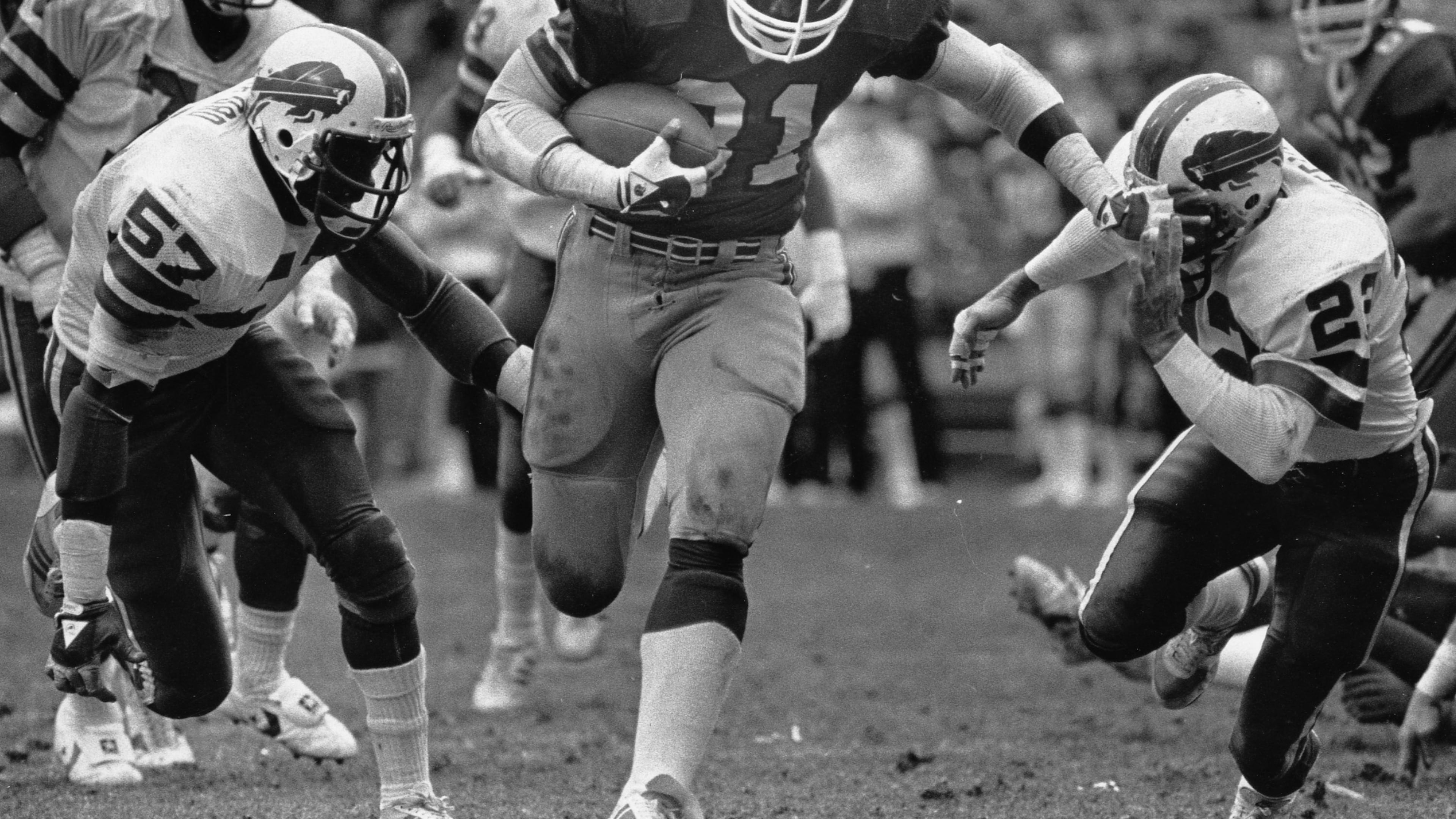William Andrews pushes through a hole against the Buffalo Bills in 1984 (Louie Favorite/AJC staff)