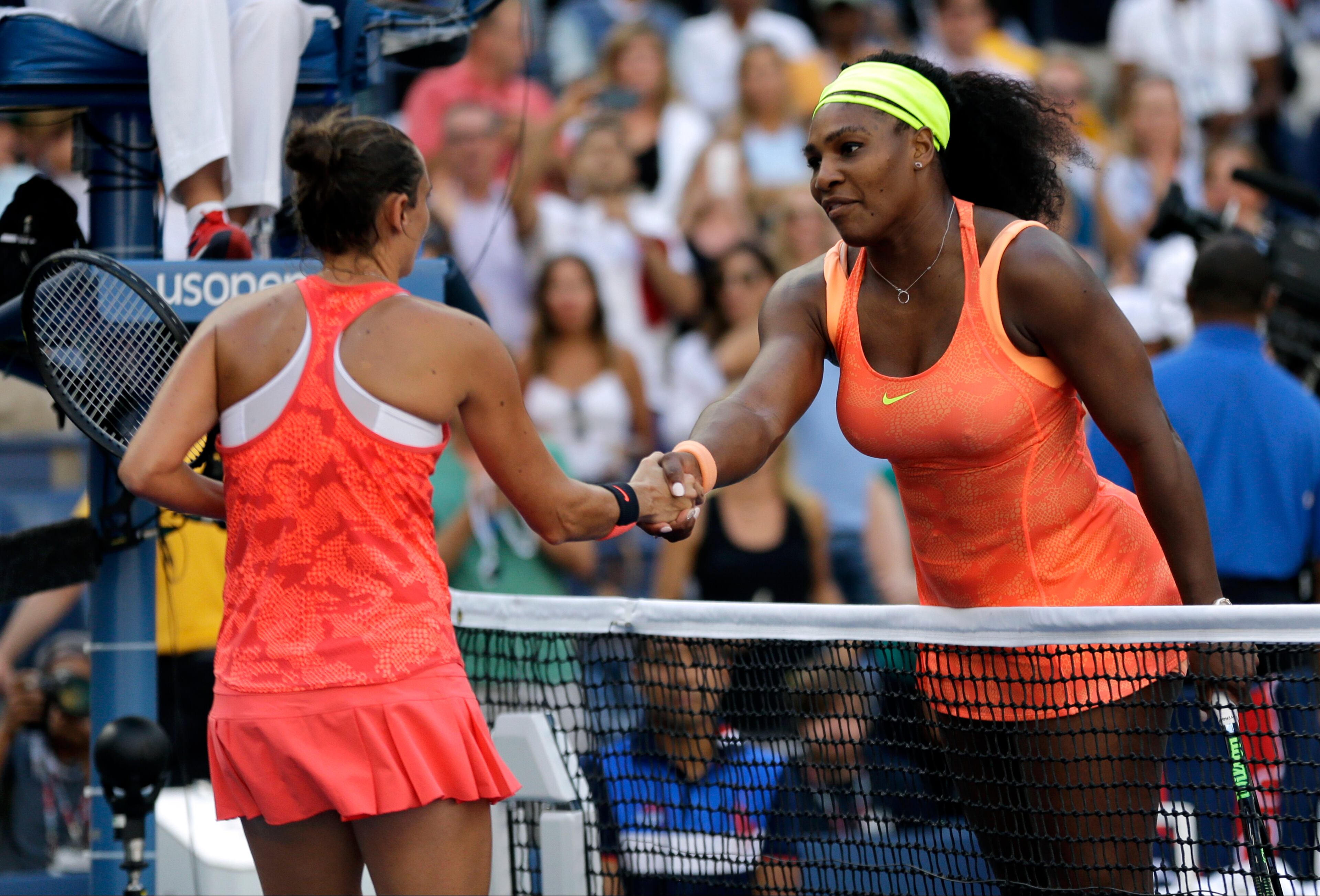 Serena Williams, right, shakes hands with Roberta Vinci, of Italy, after losing a semifinal match at the U.S. Open tennis tournament, Friday, Sept. 11, 2015, in New York. (AP Photo/David Goldman)