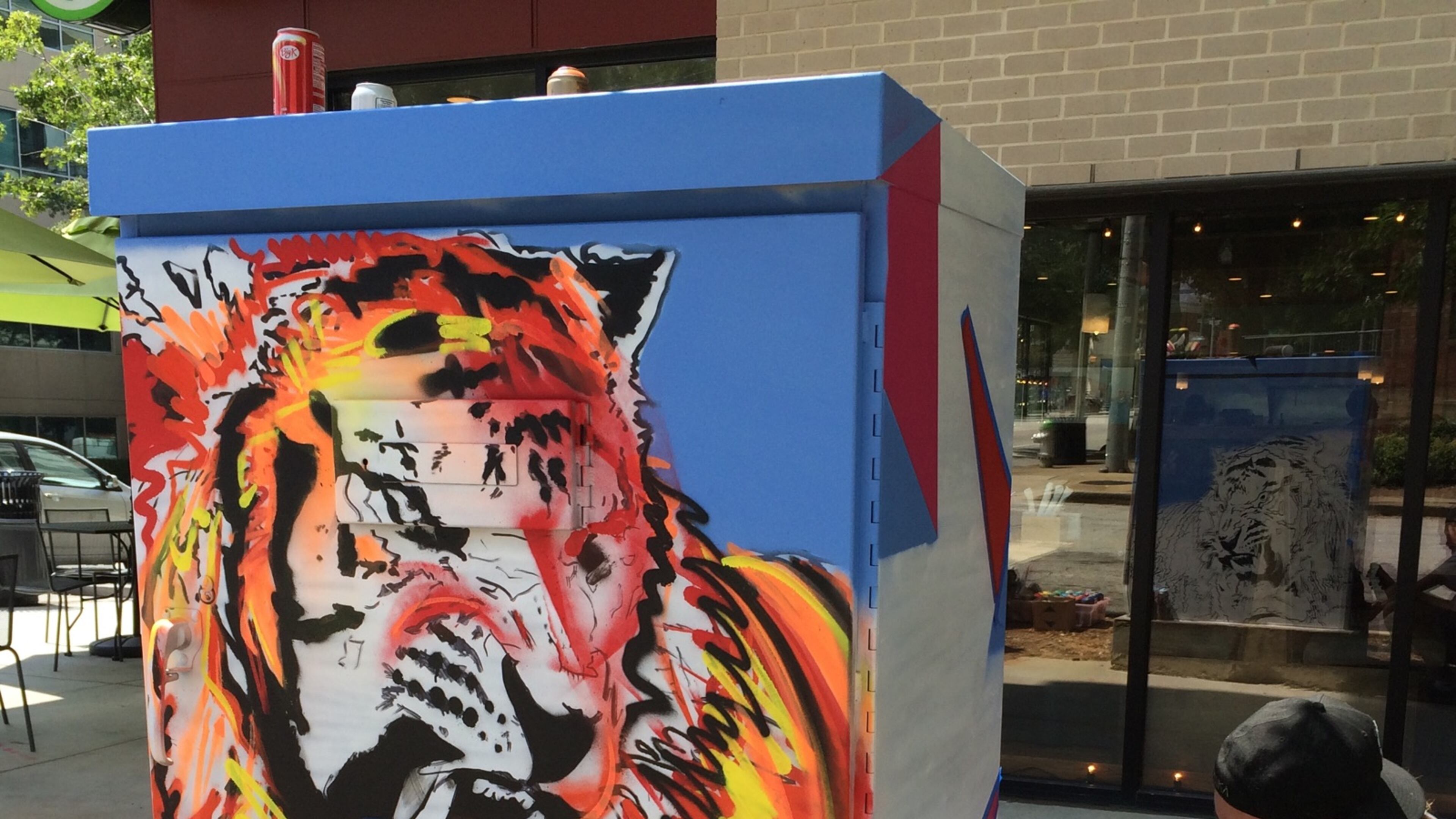 Adam Crawford’s tiger is at the corner of West Ponce de Leon Avenue and Ponce Place in front of Taziki’s Mediterranean Cafe. Photo courtesy of Larry Holland.
