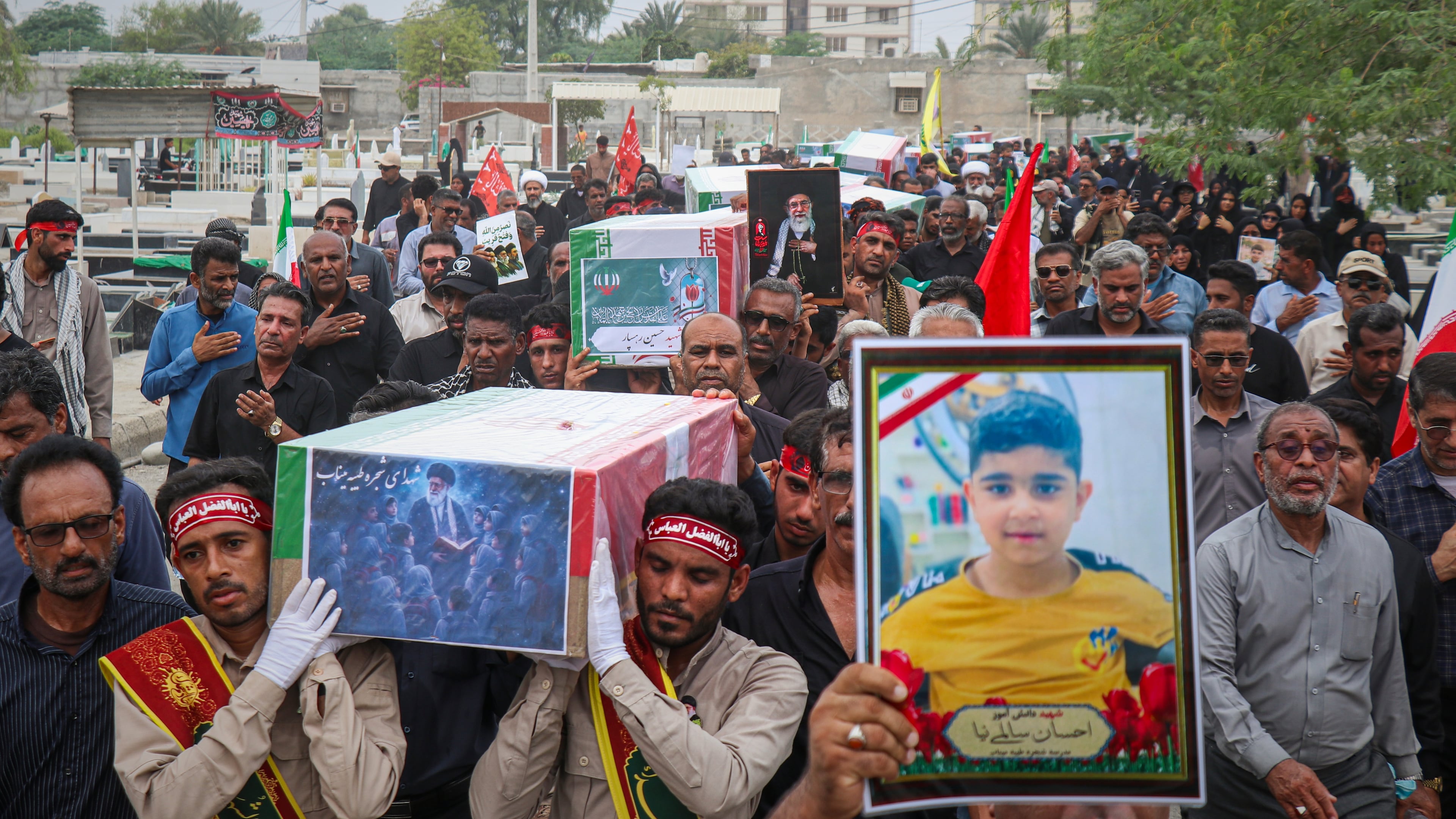 Mourners carry the coffins containing additional remains of victims identified through DNA testing during funeral ceremonies in Minab, Iran, Tuesday, July 22, 2026, nearly five months after they were killed in the Feb. 28 strike on the Shajareh Tayyebeh School.(Razieh Poudat/ISNA via AP)