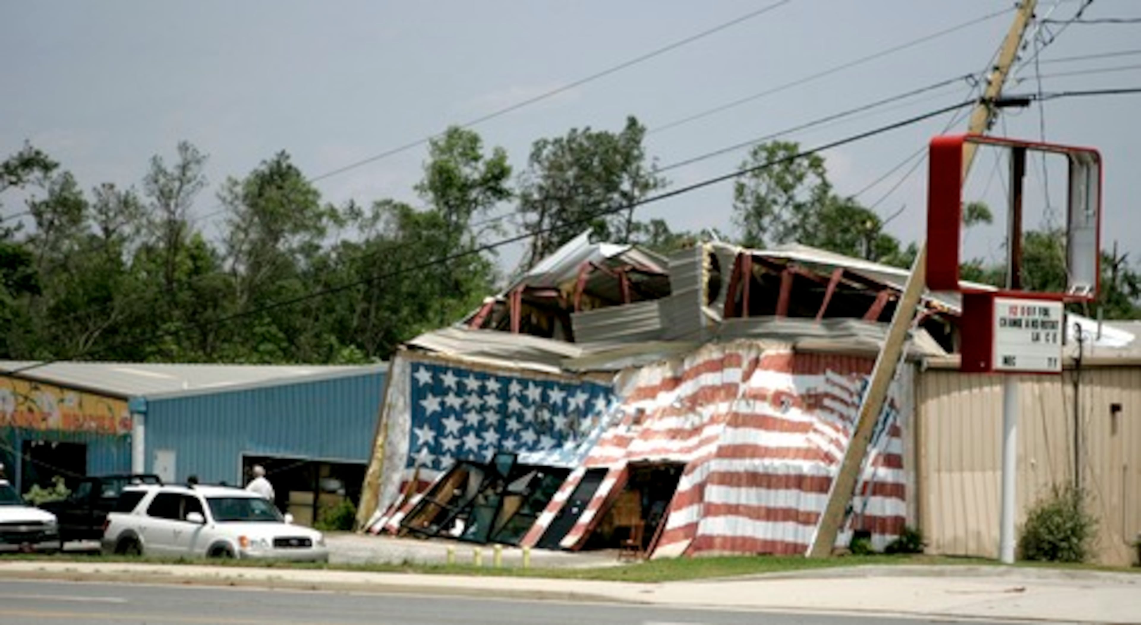 Authorities say one person is dead after severe storms cut a swath through Georgia, downing trees and damaging homes and businesses in at least 19 counties.