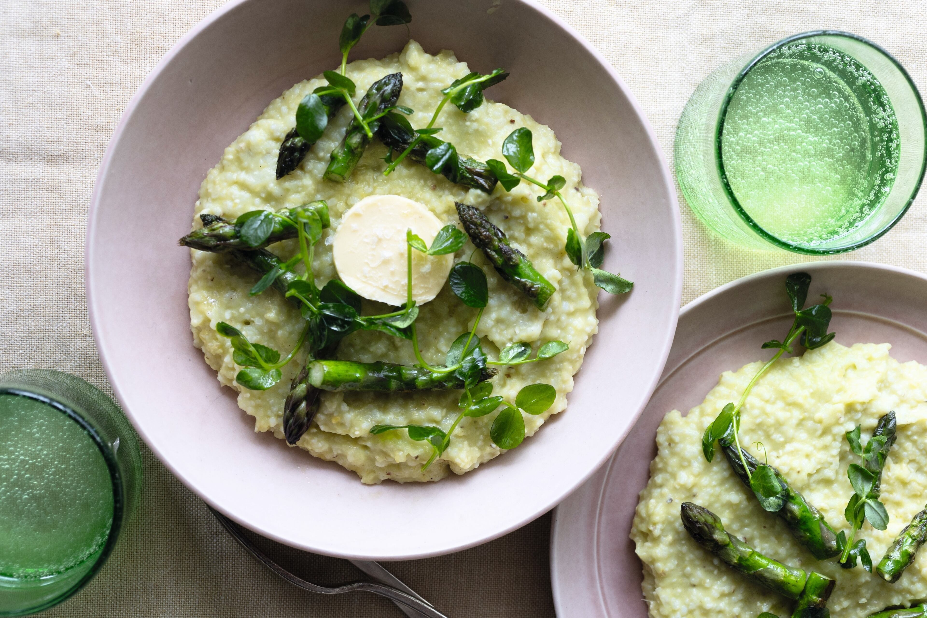 No-Waste Asparagus Grits use every part of the asparagus spear, including the woody end. It is shown here garnished with a round of butter. (Courtesy of Kelly Berry/Gibbs Smith Books)