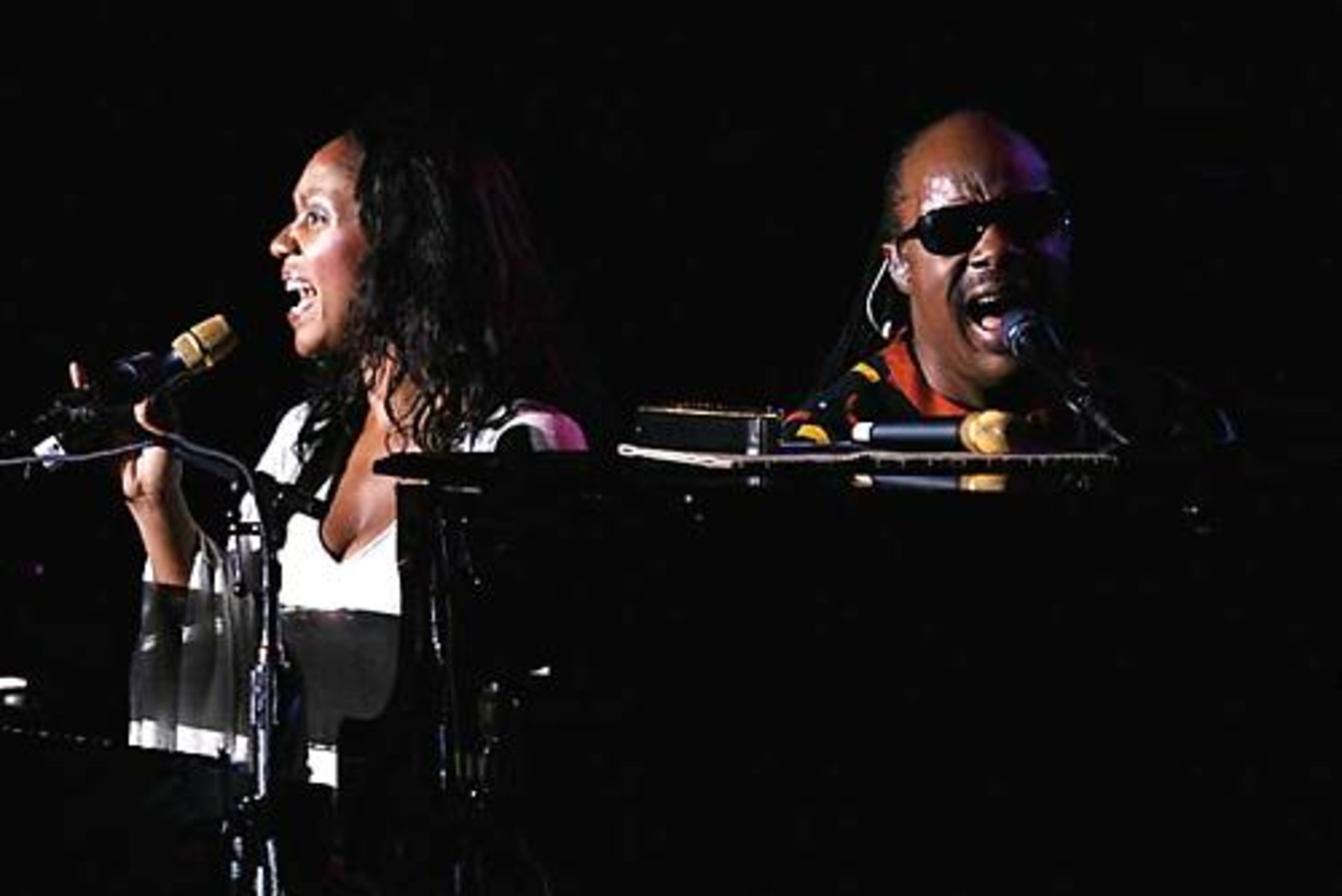 Stevie Wonder and his daughter, Aisha Morris, open the show with "Love's In Need of Love Today" at Chastain Park Amphitheatre.