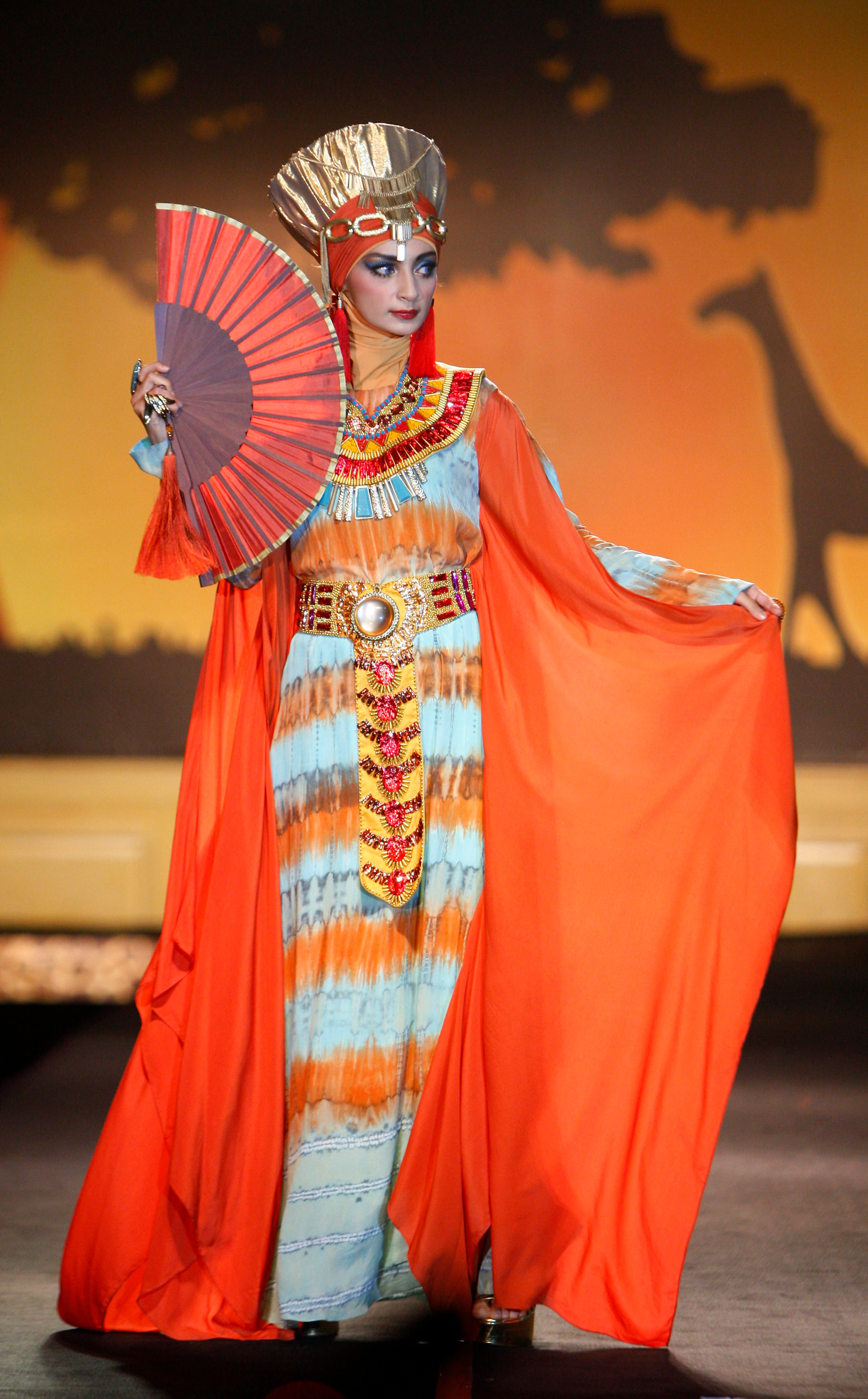 A model presents a creation by designer Dian Pelangi from Indonesia during the Islamic Fashion Festival in Kuala Lumpur, Malaysia, Monday, Nov. 5, 2012.