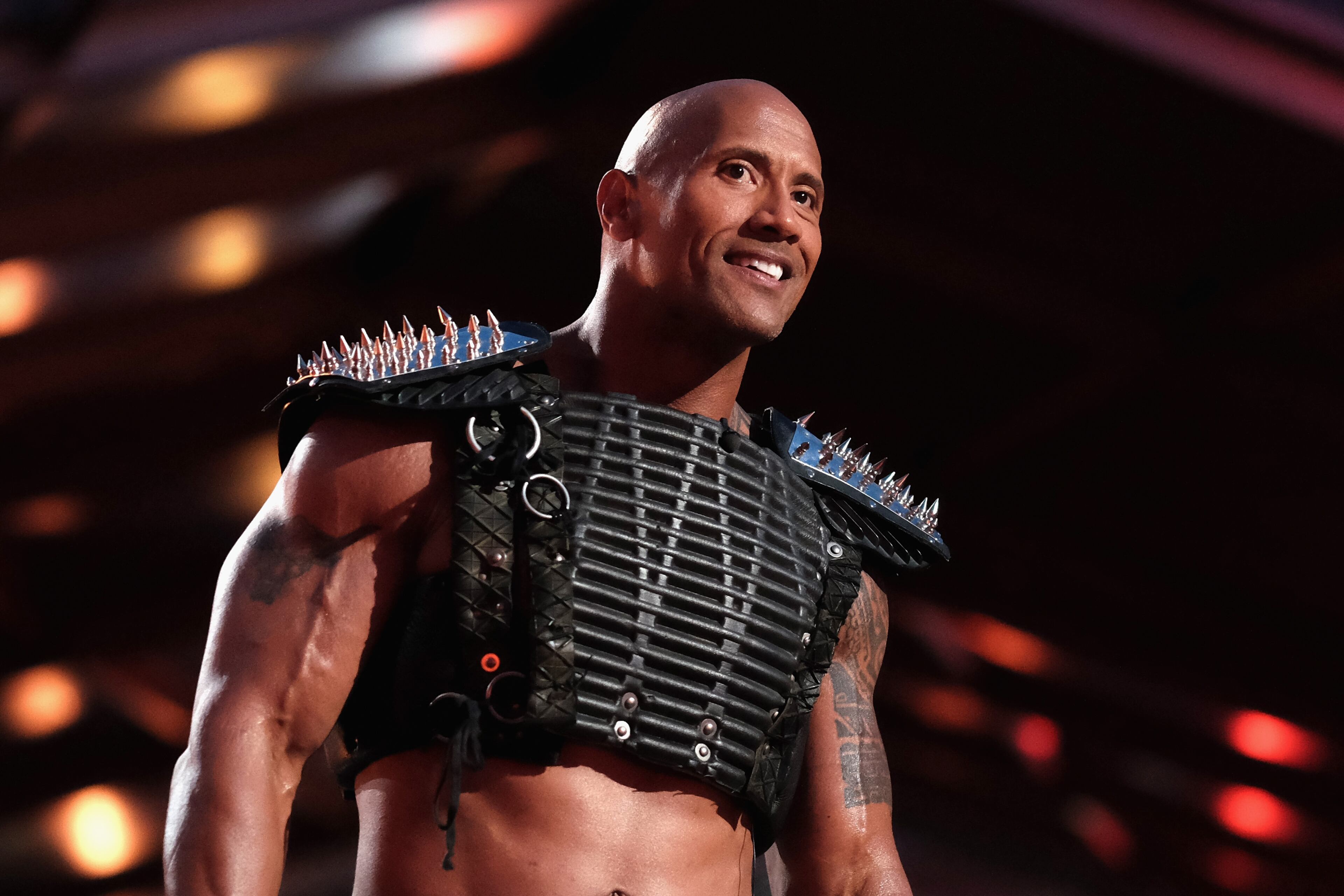 BURBANK, CALIFORNIA - APRIL 09: Host Dwayne Johnson speaks onstage during the 2016 MTV Movie Awards at Warner Bros. Studios on April 9, 2016 in Burbank, California. MTV Movie Awards airs April 10, 2016 at 8pm ET/PT. (Photo by Jason Kempin/Getty Images for MTV)