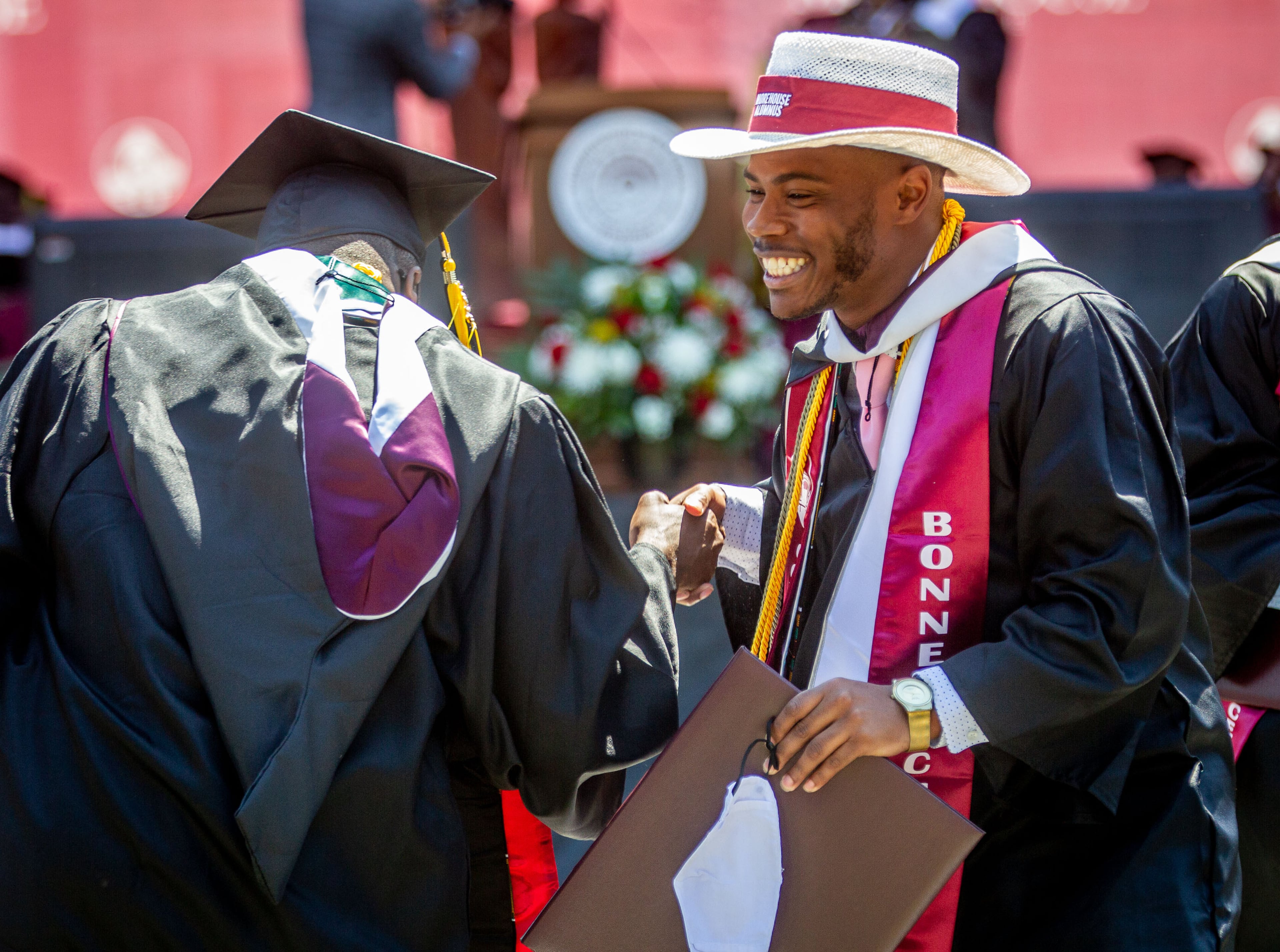 Graduates celebrate after receiving their diploma during the 137th commencement for the classes of 2020 and 2021 on the Century Campus at Morehouse College on Sunday, May 16, 2021. (Photo: Steve Schaefer for The Atlanta Journal-Constitution)