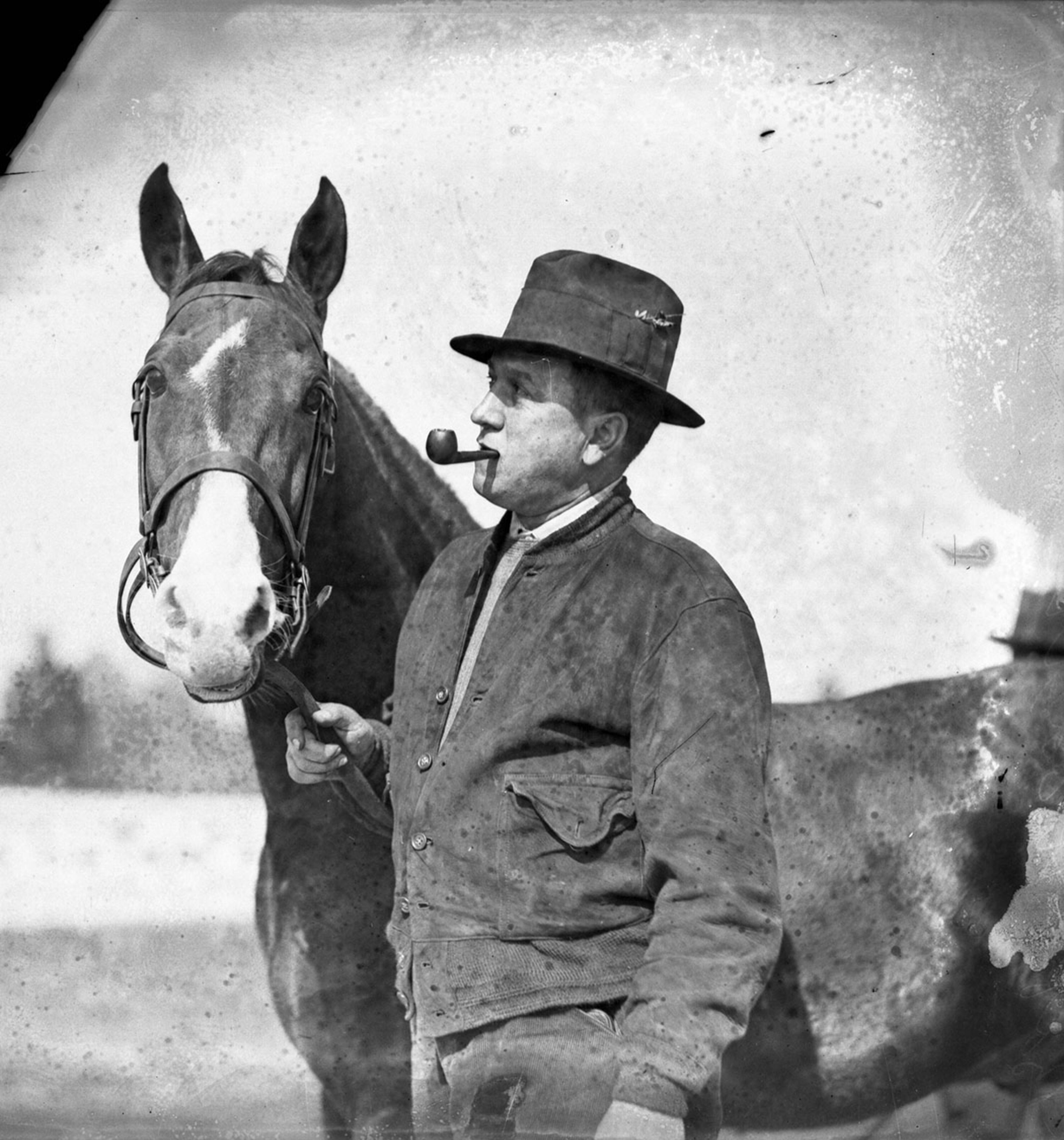 Upstairs, the cigar store established itself as the first place to go for serious pipe smokers, and over the next seven decades, attracted a clientelle that reads like a who's who of Atlanta power movers and personalities -- Govs. John Slaton, Herman Talmadge and George Busbee; Joe Torre; Robert Woodruff (seen here in 1931 smoking a pipe); Eldrin Bell; Mayor Ivan Allen Jr.; Marvin Arrington; Burt Reynolds and wrestler Abdullah the Butcher. (Lane Brothers, GSU Archives LBGlass - 157)