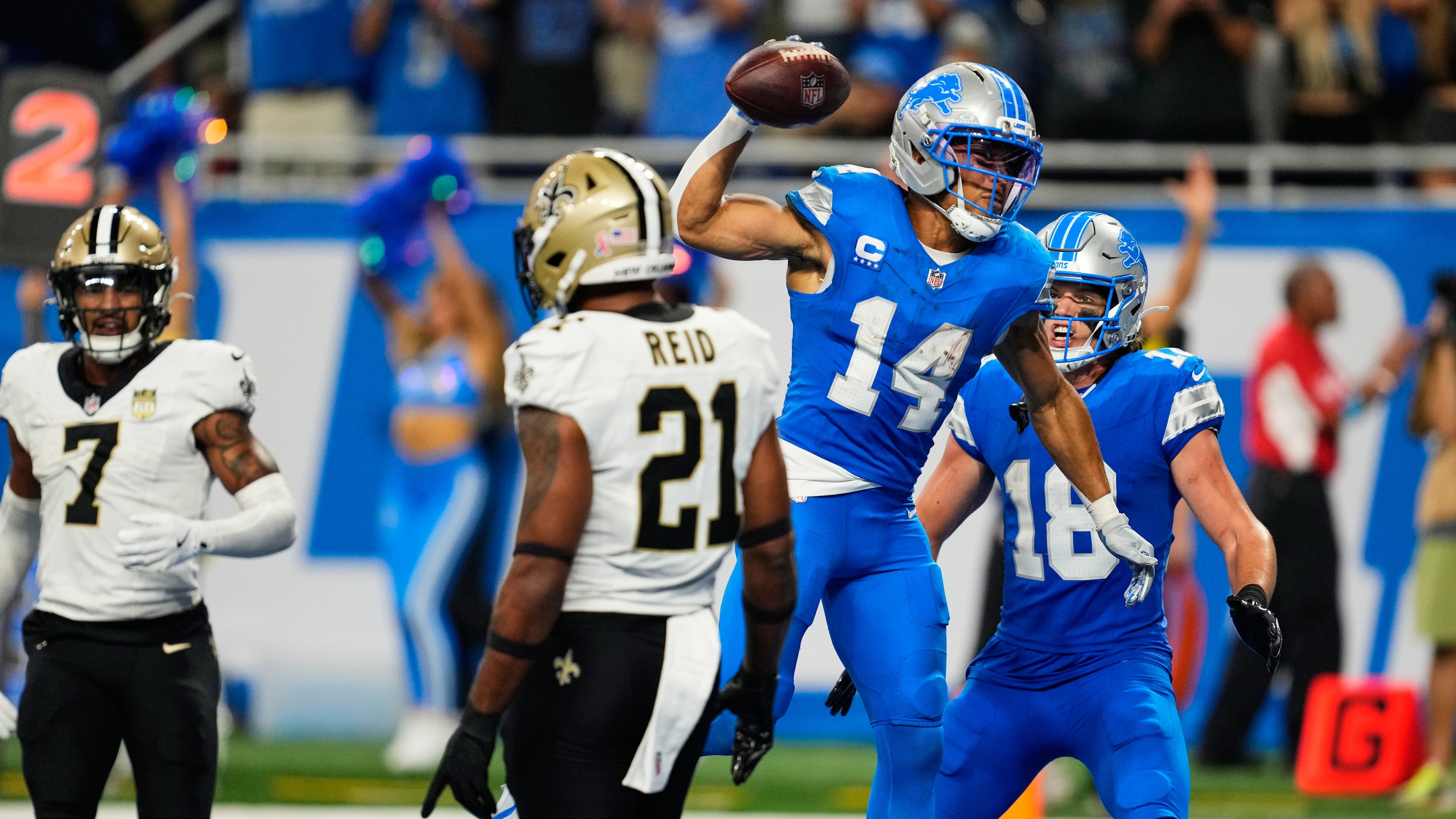 Detroit Lions wide receiver Amon-Ra St. Brown (14) celebrates his touchdown reception during overtime of an NFL football game against the New Orleans Saints, Sunday, Sept. 13, 2026, in Detroit. (AP Photo/Paul Sancya)