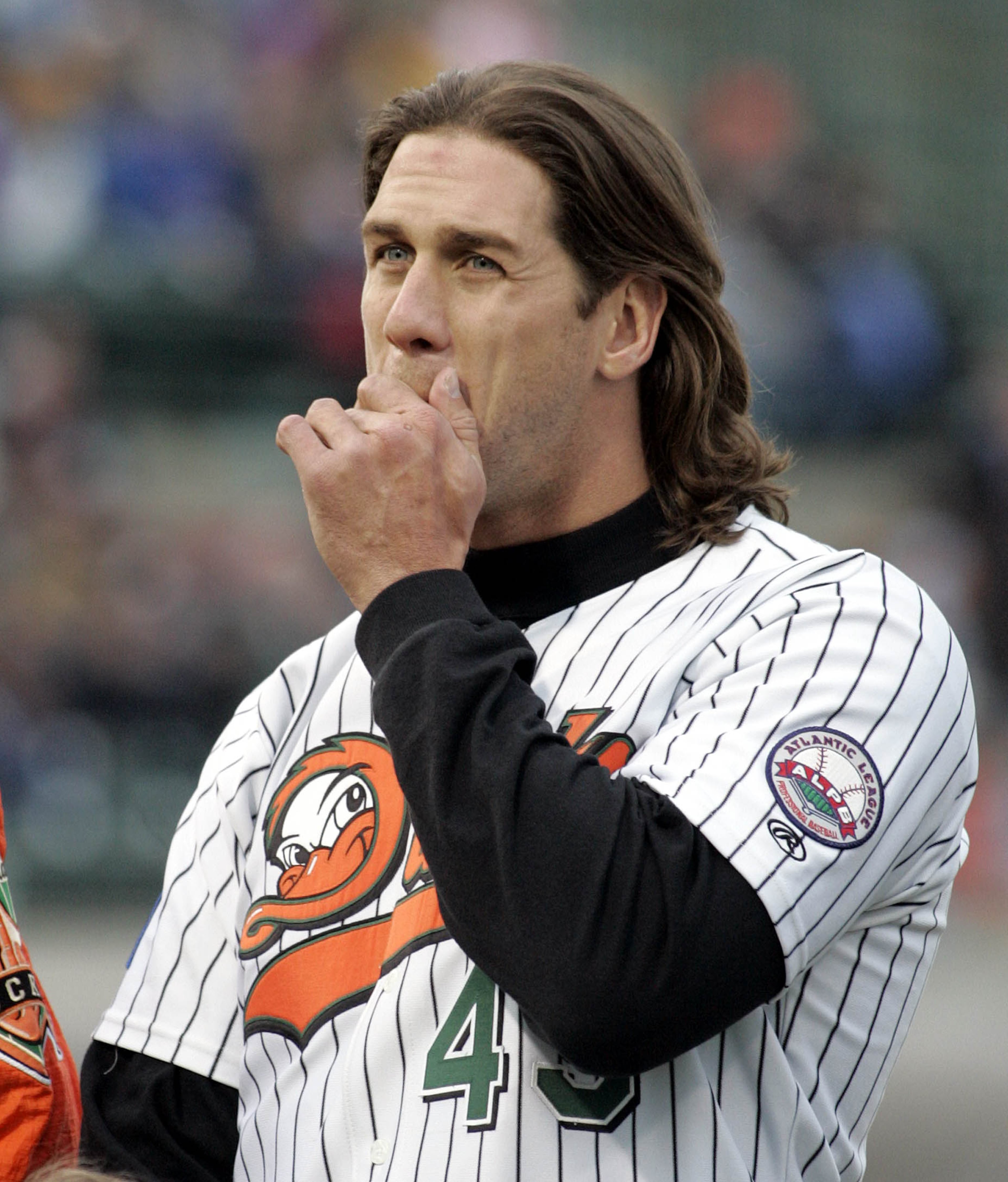Long Island Ducks pitcher John Rocker wipes his face during opening ceremonies at Citibank Park in Central Islip, N.Y., Wednesday, May 4, 2005.