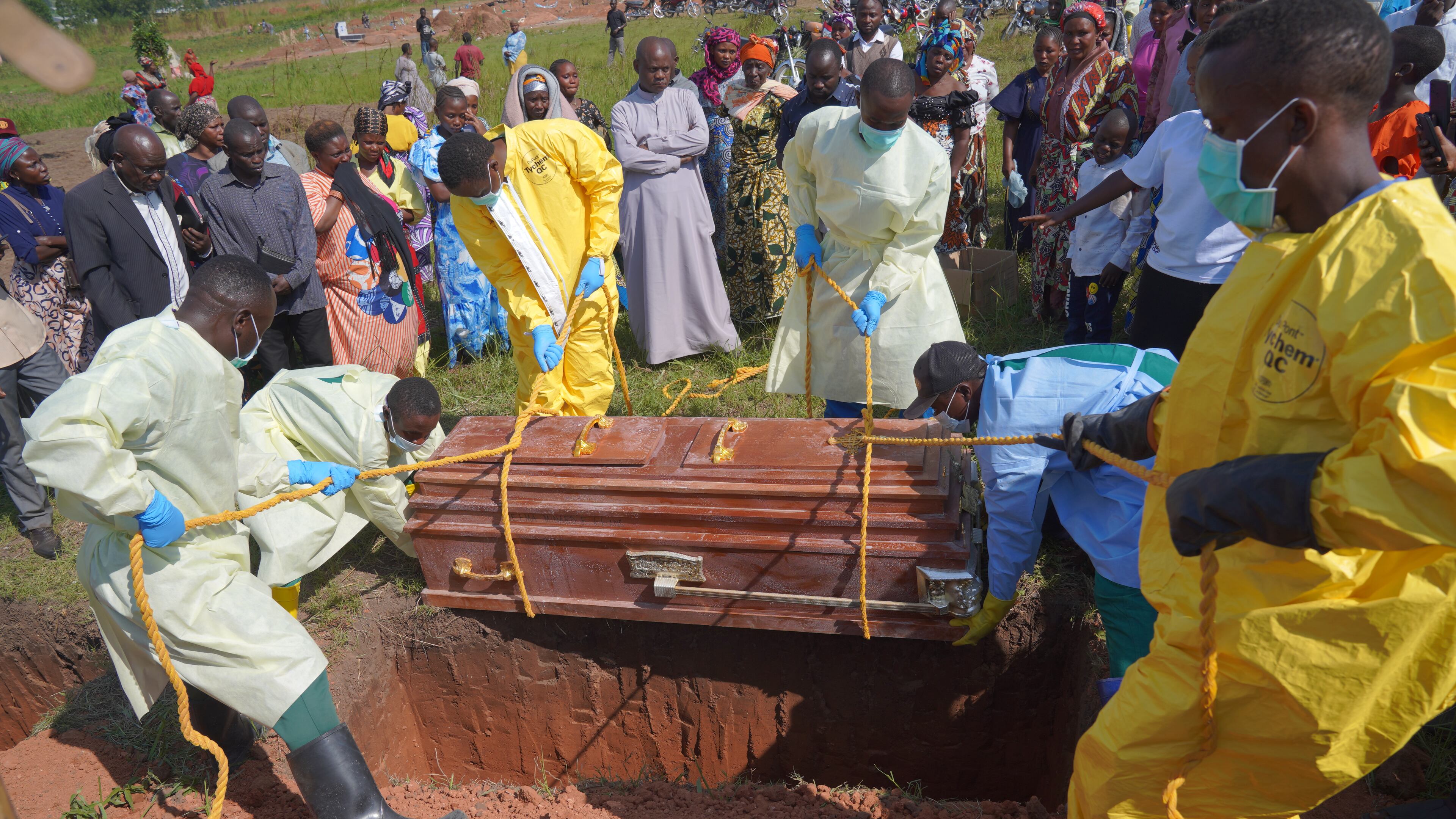 Health workers bury the coffin of Neema Minaro, a 66 year old woman who died of the Ebola virus, in Bunia, Congo, Wednesday, Sept. 2, 2026. (AP Photo/Dieudonne Dirole)
