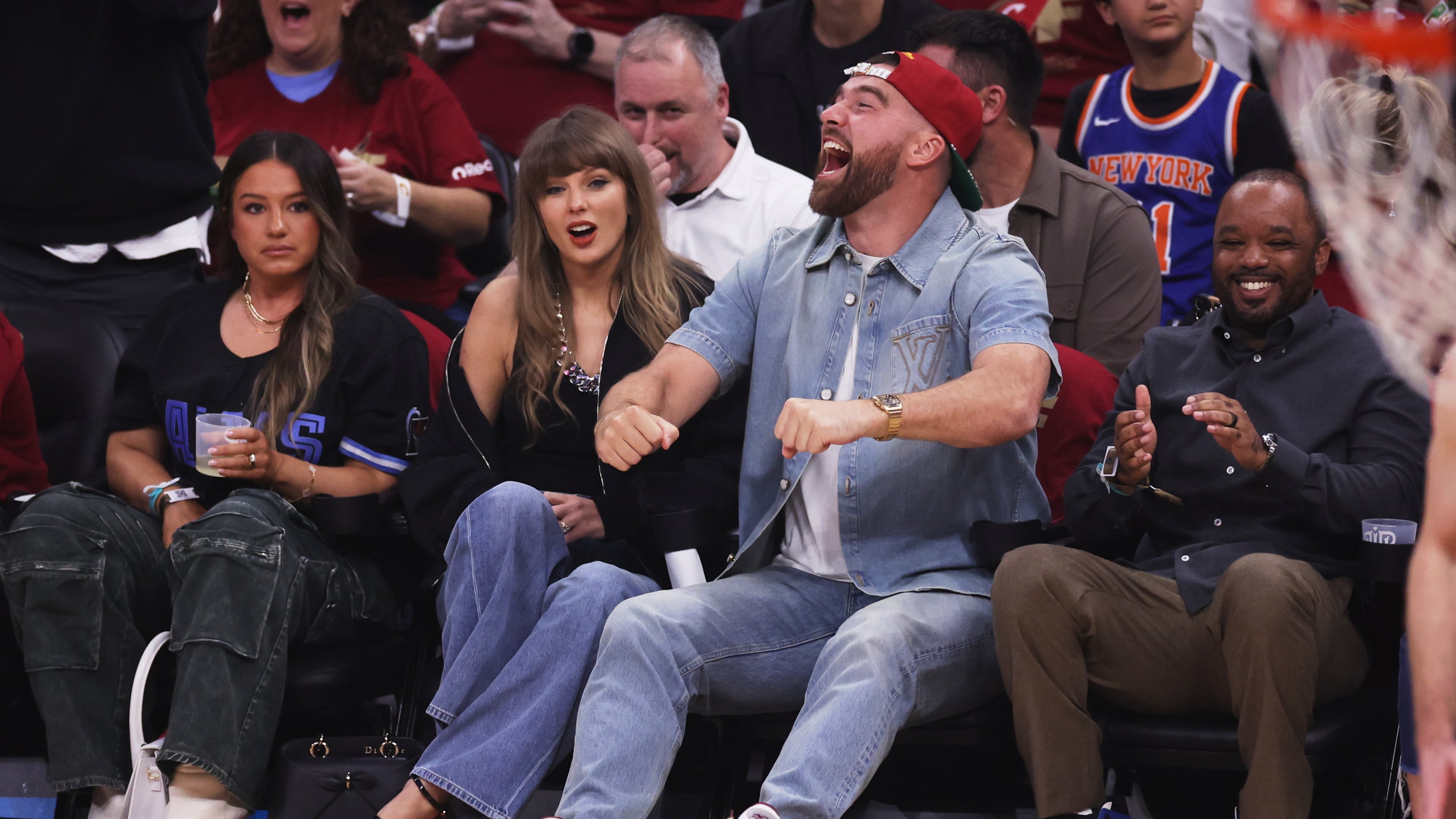 Taylor Swift and Travis Kelce watch the first half of Game 3 in the Eastern Conference finals NBA basketball playoffs series between the New York Knicks and the Cleveland Cavaliers in Cleveland, Saturday, May 23, 2026. (AP Photo/Tim Phillis)