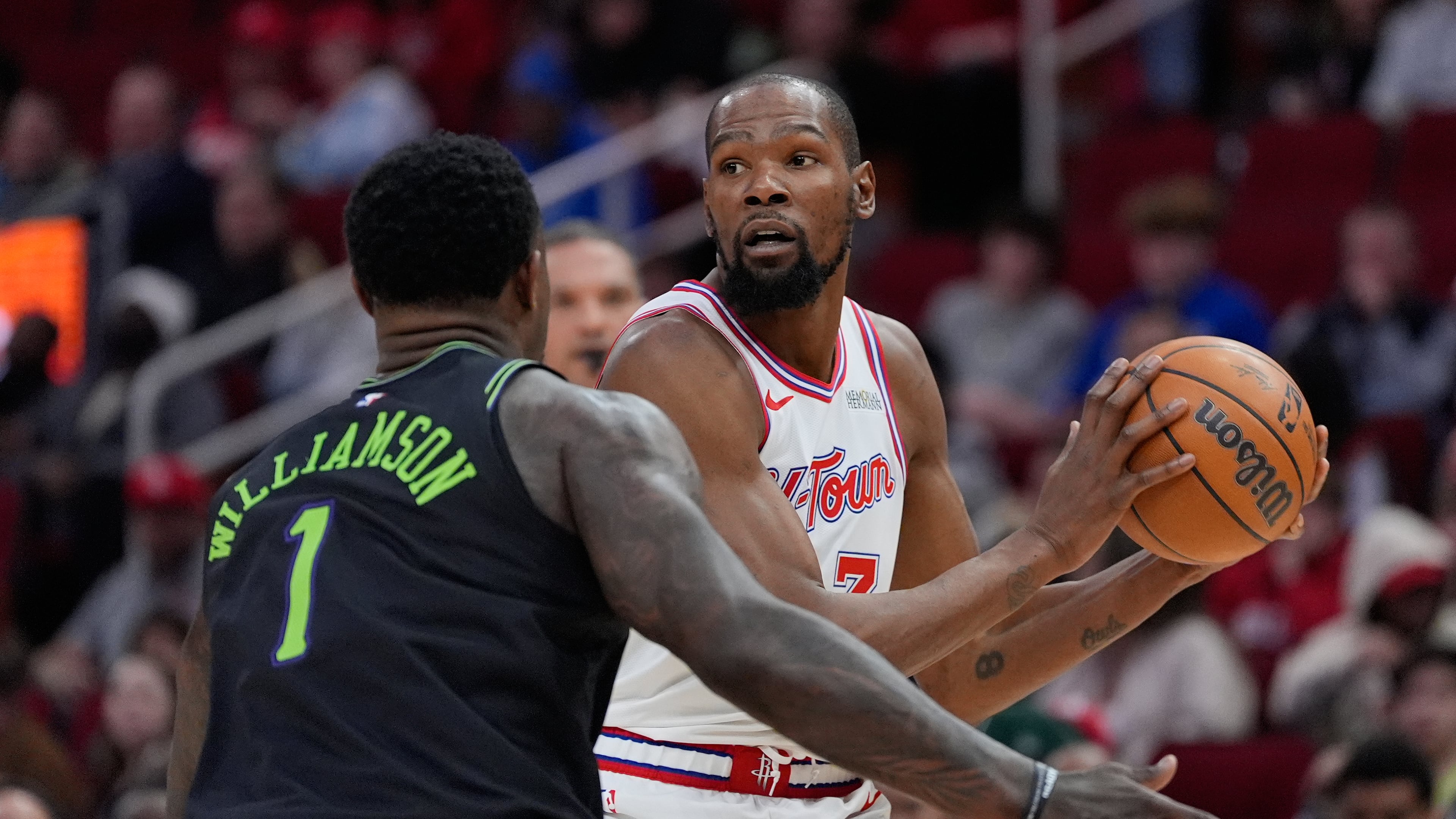 Houston Rockets forward Kevin Durant (7) controls the ball against New Orleans Pelicans forward Zion Williamson (1) during the second half of an NBA basketball game in Houston, Sunday, Jan. 18, 2026. (AP Photo/Ashley Landis)
