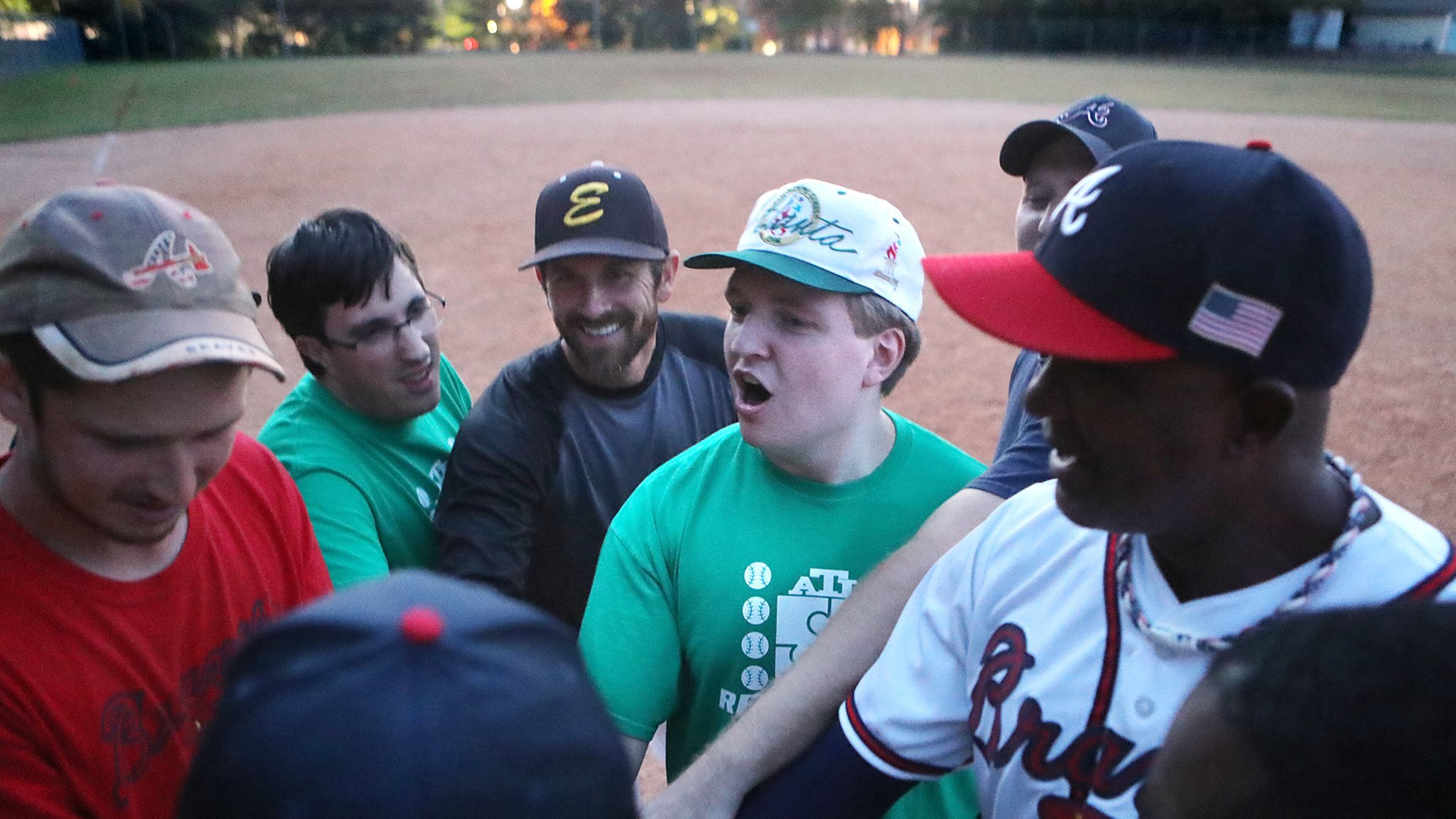 Taylor Duncan (center), founder of the Alternative Baseball Organization, fires up his players during an ABO game at McEachern Memorial United Methodist Church on Nov. 1, 2016, in Powder Springs. The ABO is a developmental organization geared toward teens and adults with autism, Asperger’s syndrome, Down syndrome and other forms of special needs. CURTIS COMPTON / CCOMPTON@AJC.COM