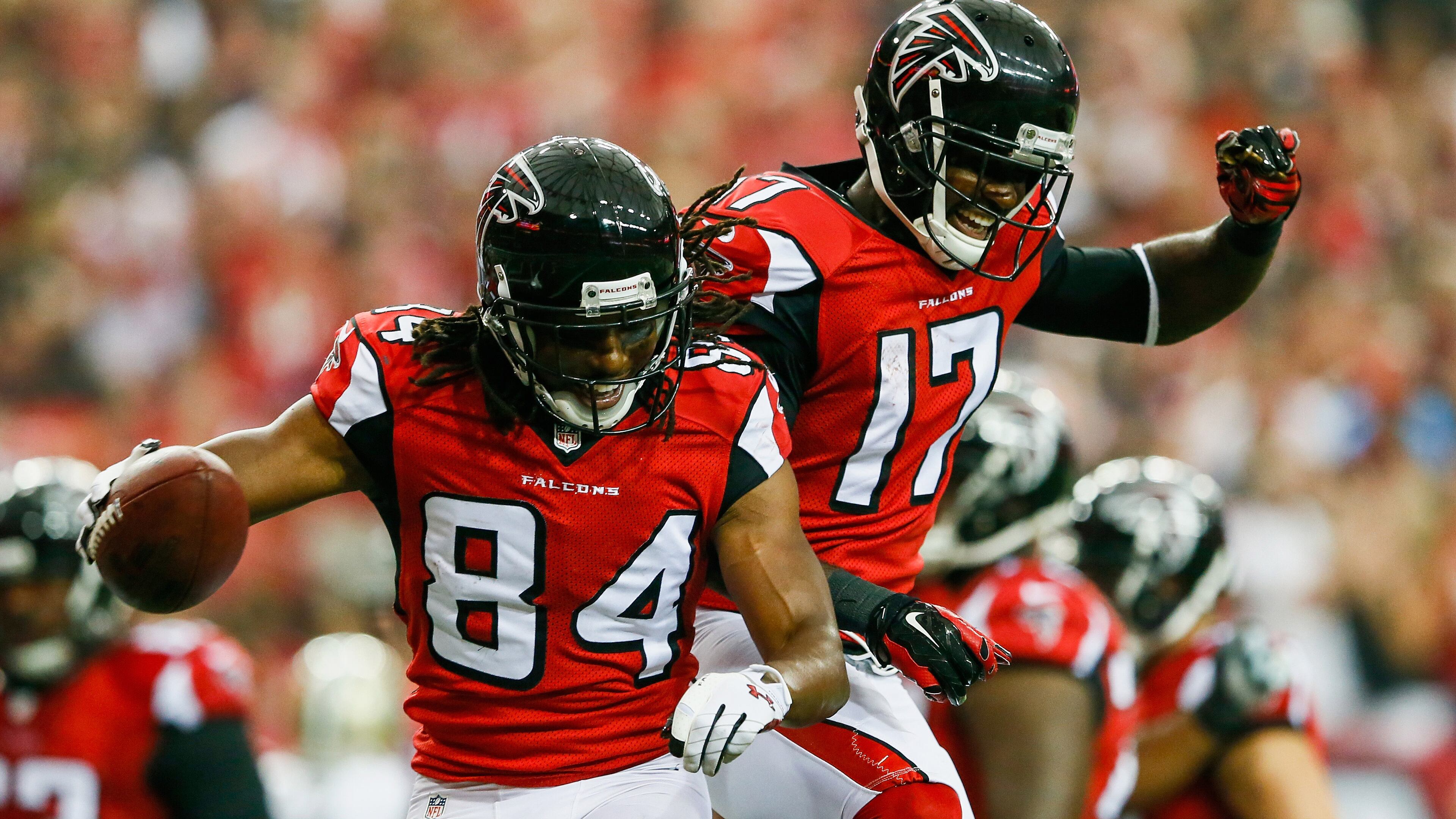 Roddy White #84 celebrates with Devin Hester #17 of the Atlanta Falcons after a touchdown catch in the first half against the New Orleans Saints at the Georgia Dome on September 7, 2014 in Atlanta, Georgia.