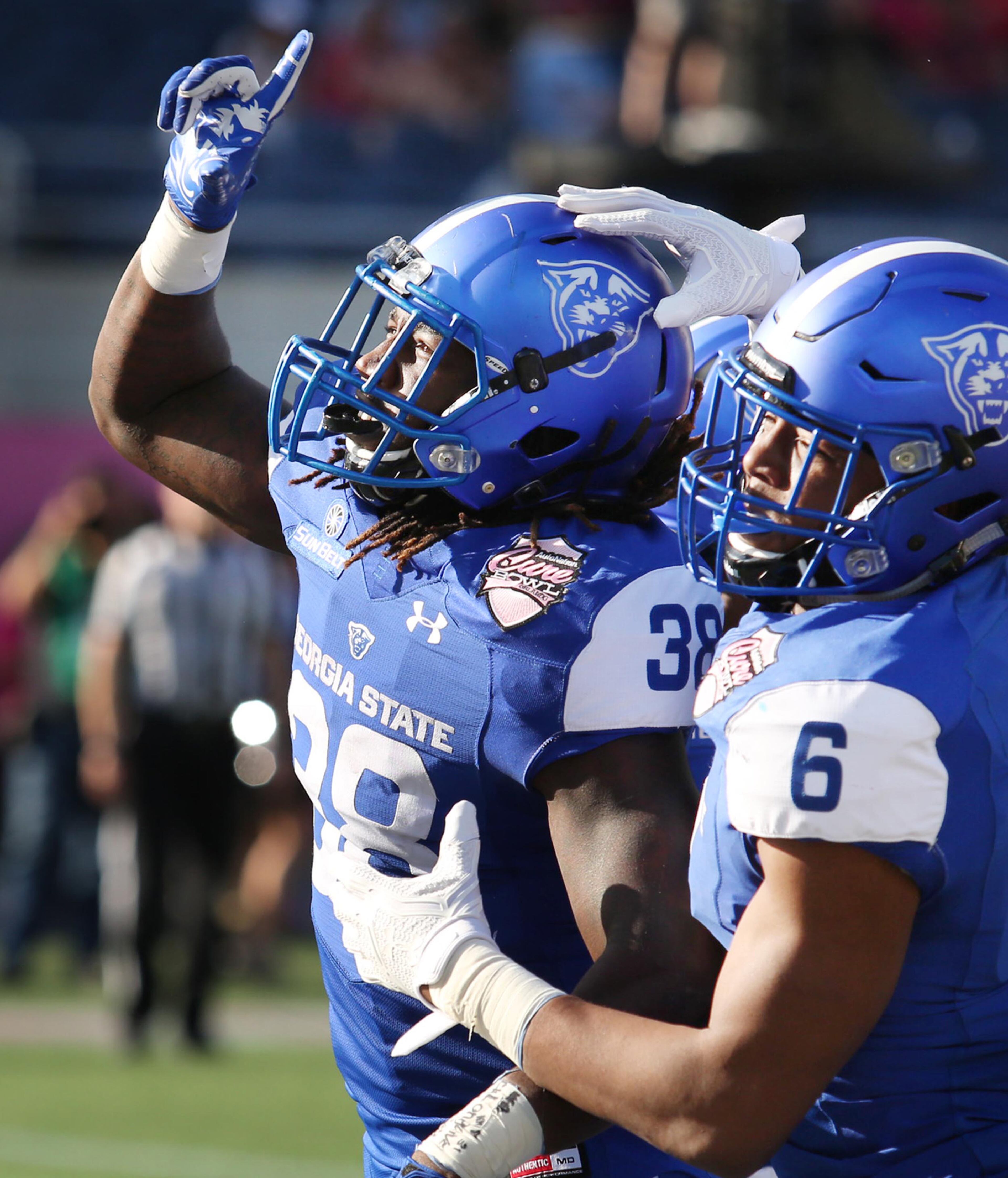 Georgia State running back Demarcus Kirk (38) celebrates after scoring a touchdown against Western Kentucky during the Cure Bowl at Camping World Stadium in Orlando, Fla., on Saturday, Dec. 16, 2017. (Stephen M. Dowell/Orlando Sentinel/TNS)