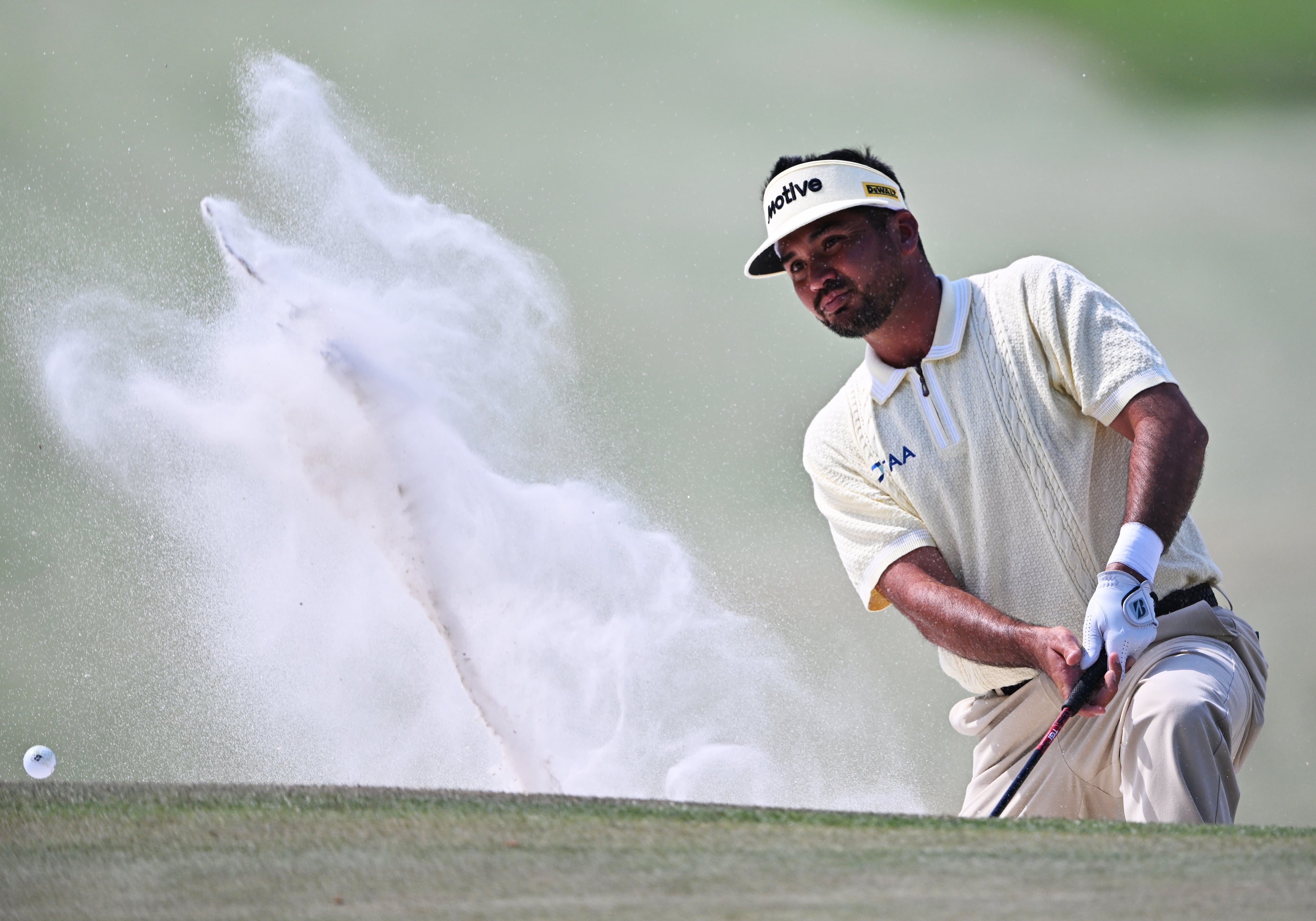 Jason Day hits out of bunker on seventh hole during final round of the Masters, at Augusta National Golf Club, Sunday, April 12, 2026, in Augusta, GA (Hyosub Shin/AJC)