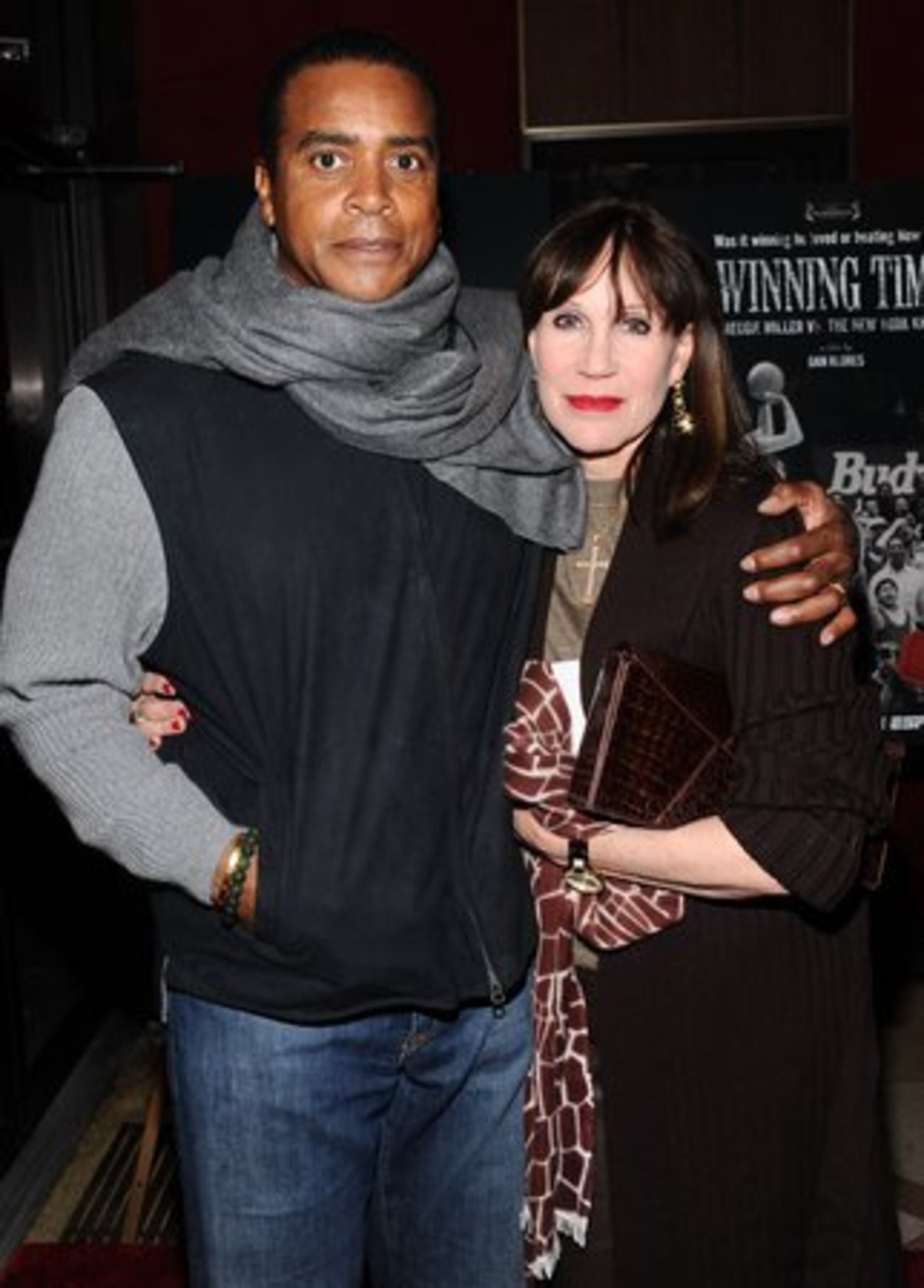 Former NFL player Ahmad Rashad and wife Sale Johnson show their interest in an indoor sport.