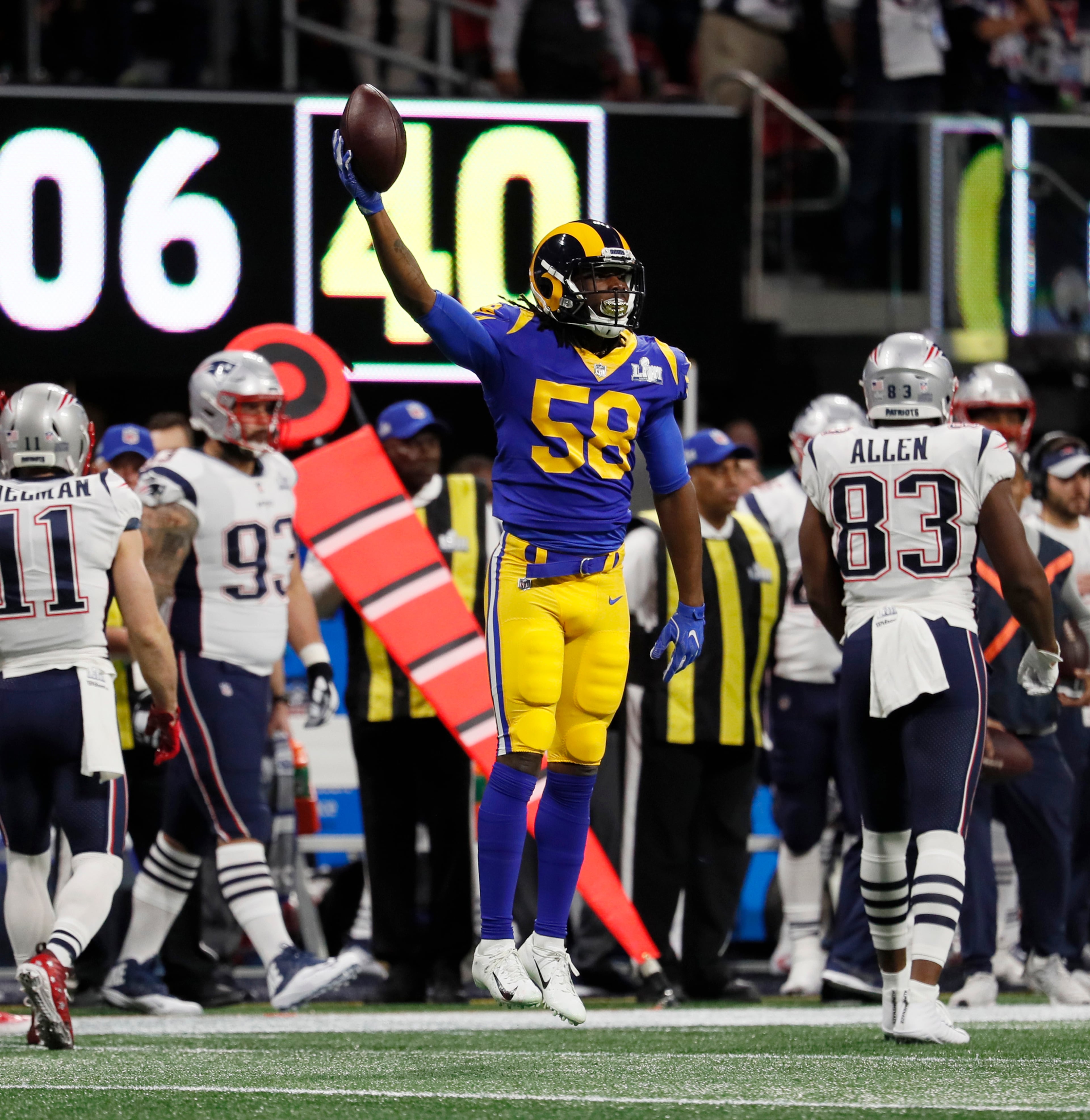 2/3/19 - Atlanta - Los Angeles Rams inside linebacker Cory Littleton (58) celebrates his first quarter interception against the New England Patriots on Sunday, Feb. 3, 2019 in Super Bowl LIII at Mercedes-Benz Stadium in Atlanta, Ga. Bob Andres / bandres@ajc.com