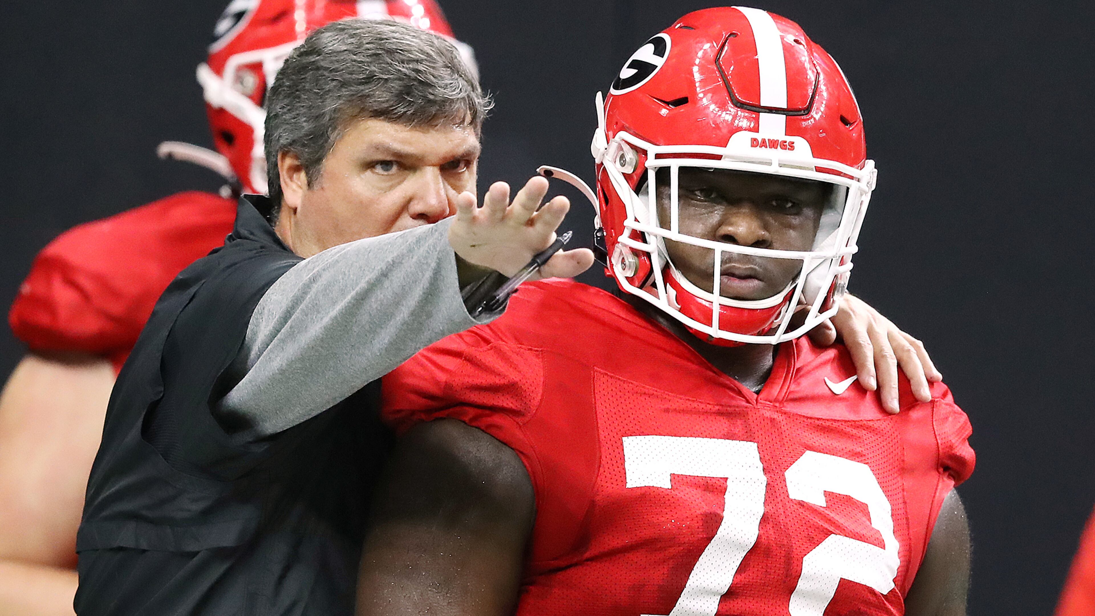 Georgia offensive line coach Matt Luke works with offensive lineman Netori Johnson during team practice Sunday, Dec. 29, 2019, as team prepares for the Sugar Bowl against Baylor at Mercedes-Benz Superdome in New Orleans. (Curtis Compton/ccompton@ajc.com)