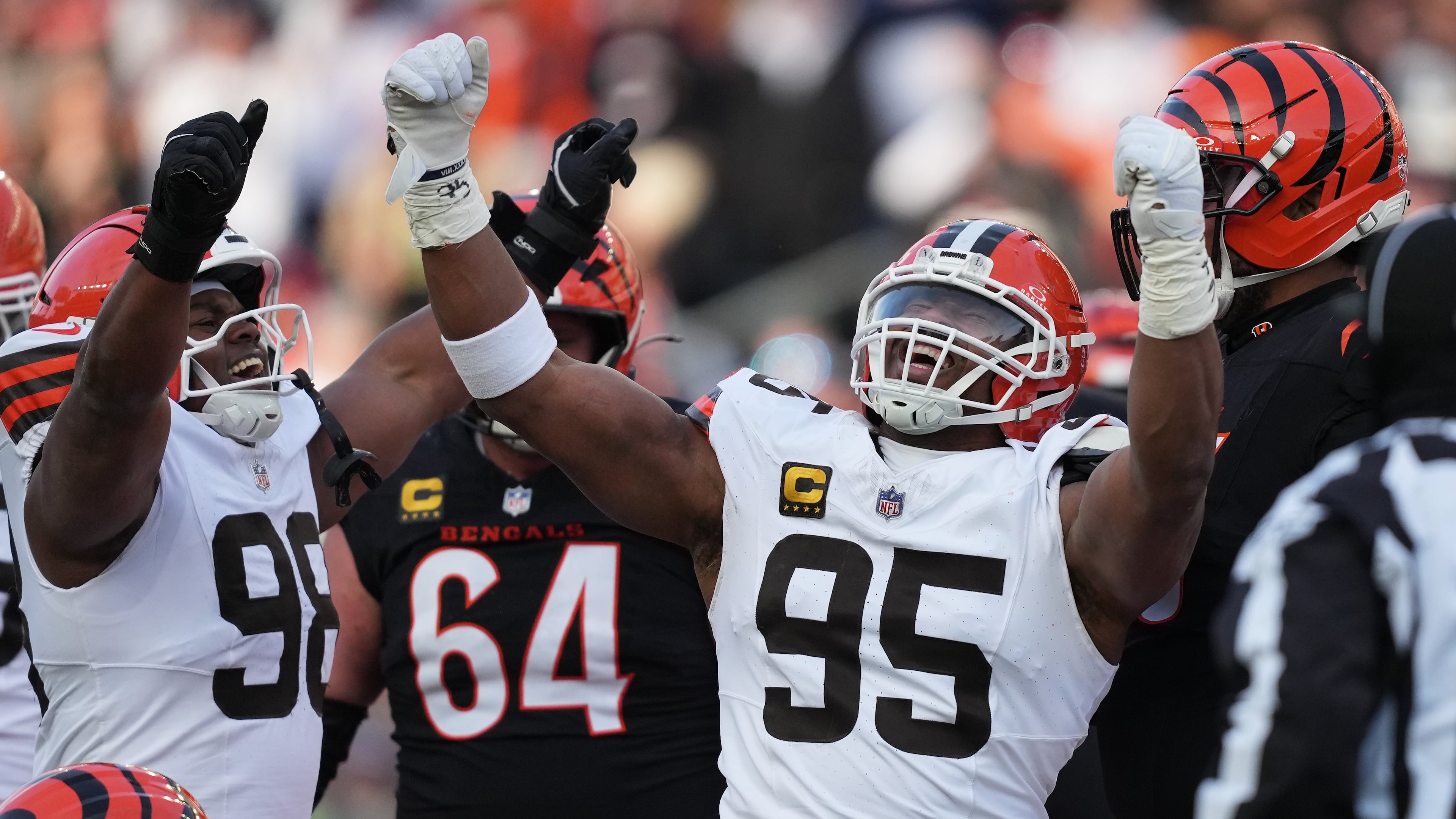 Cleveland Browns defensive end Myles Garrett (95) celebrates with defensive end Adin Huntington (98) after sacking Cincinnati Bengals quarterback Joe Burrow to set an NFL record for sacks in the regular season during the second half of an NFL football game, Sunday, Jan. 4, 2026, in Cincinnati. (AP Photo/Joshua A. Bickel)