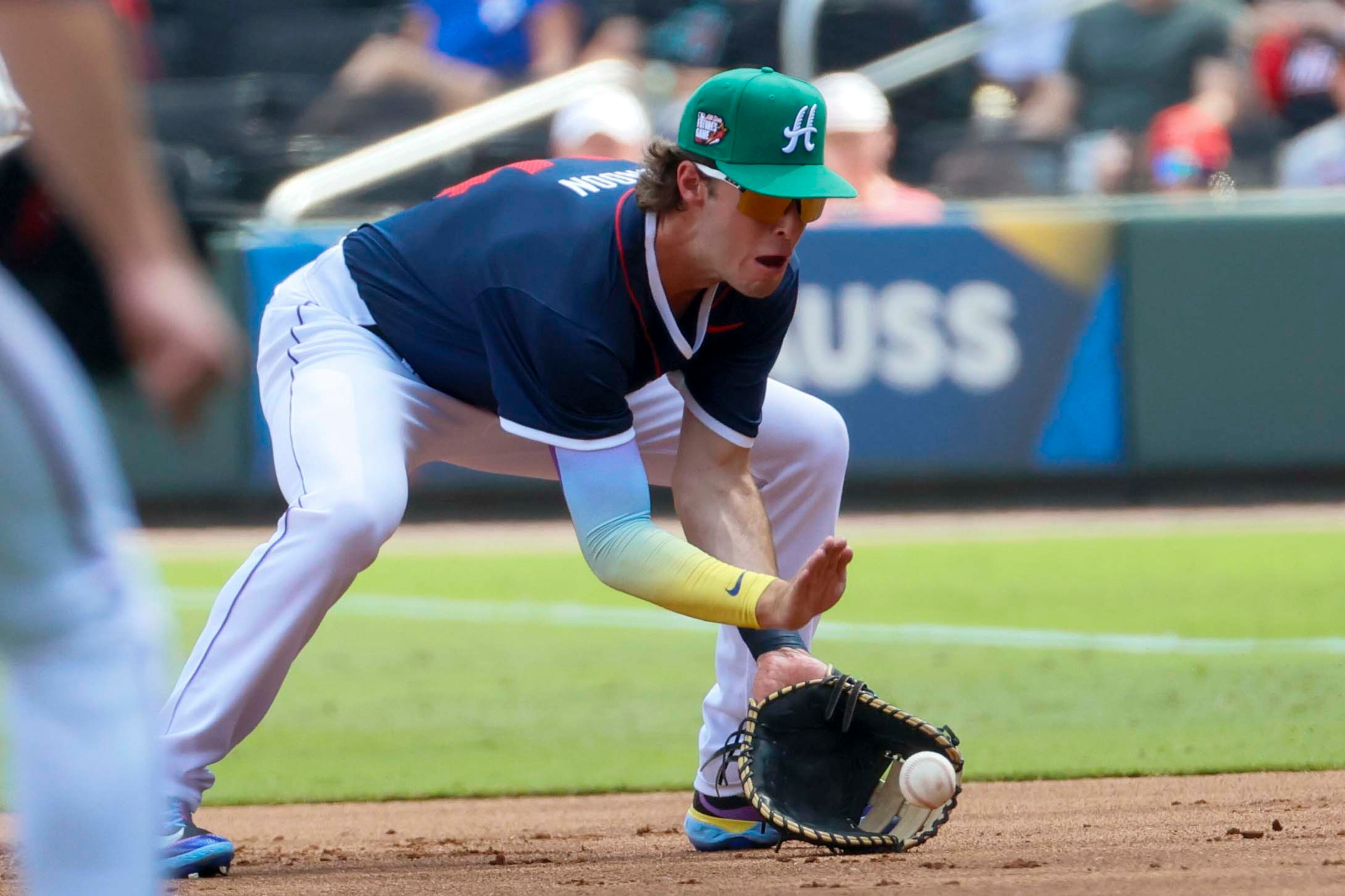 National League infielder Charlie Condon (24) of the Colorado Rockies grabs a ground ball during the MLB All-Star Futures Game at Truist Park on Saturday, July 12, 2025, in Atlanta.
(Miguel Martinez/ AJC)