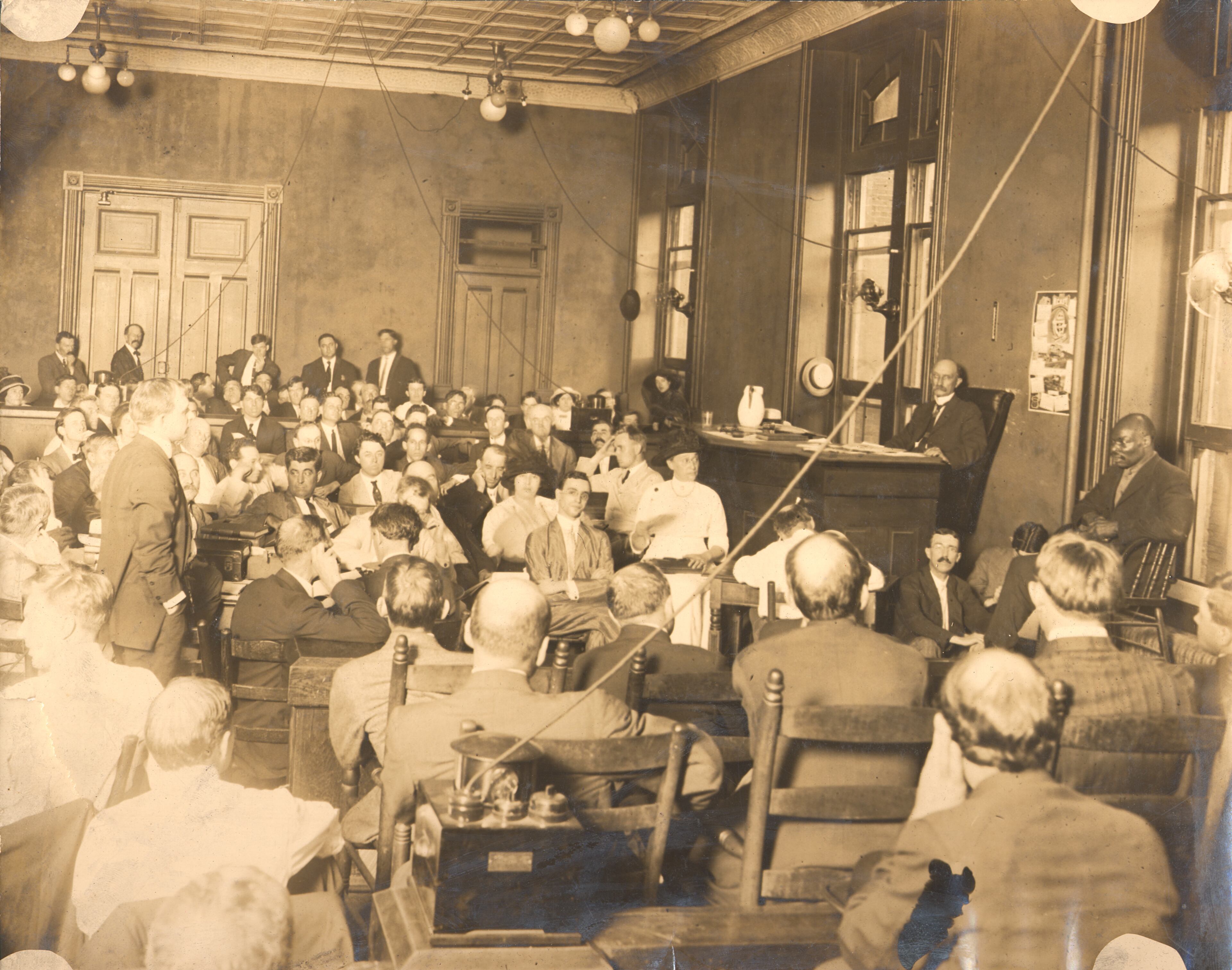 This photo shows prosecutor Hugh Dorsey, standing at left, examining witness Jim Conley, on the stand at right, during the trial of Leo Frank, who is seated at center. It was Conley's testimony that sealed Frank's fate. This photo from the Frank trial was shot by Winn in 1913. Winn's grandson, Walter Winn of Decatur, said this image and many others from Winn's career have been handed down to succeeding generations of the family.