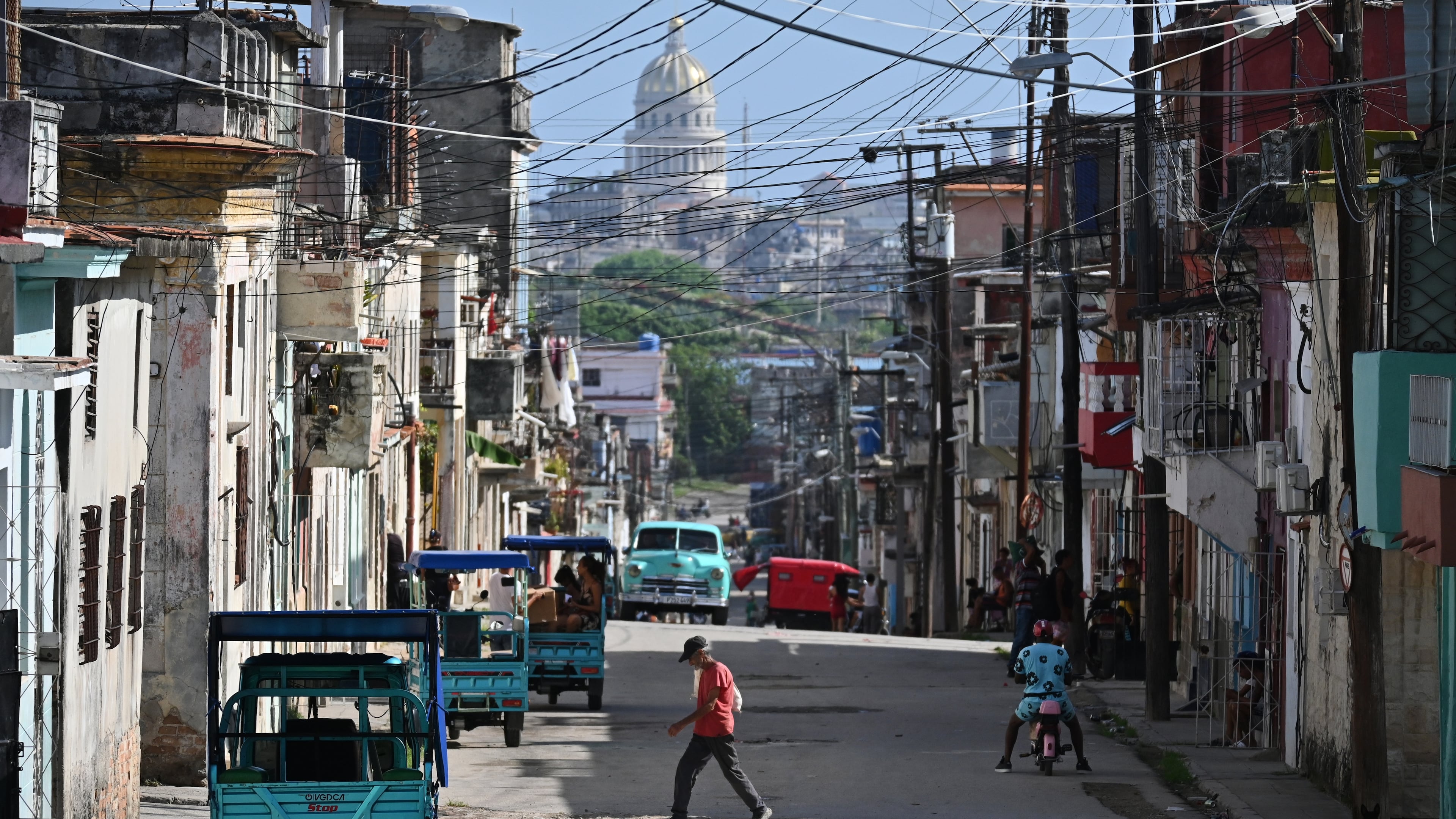 A man crosses a street in Havana, Monday, May 25, 2026. (AP Photo/Jorge Luis Banos)