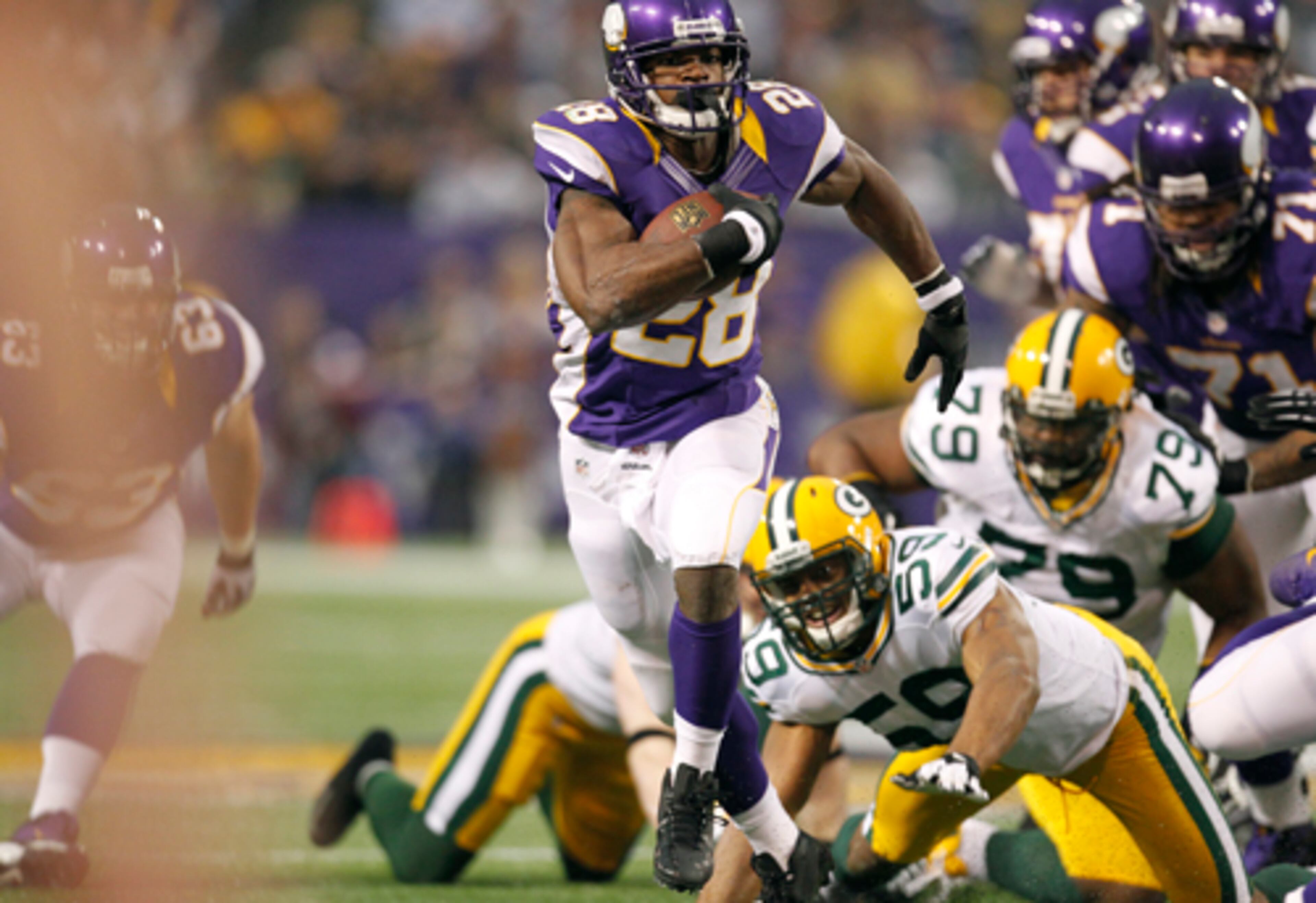 Minnesota Vikings running back Adrian Peterson became just the seventh tailback in NFL history to rush for more than 2,000 yards in a season. Peterson gained 199 yards against the Green Packers Sunday, finishing the season with 2,097 yards.