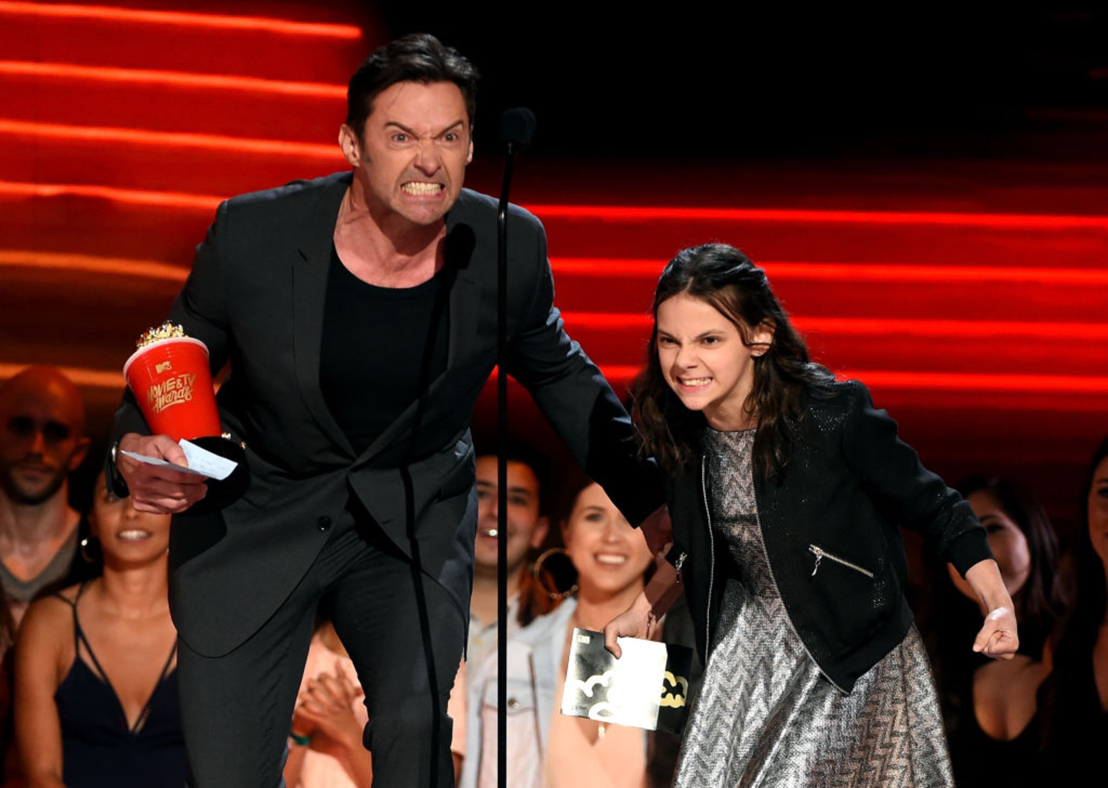 LOS ANGELES, CA - MAY 07: Actors Hugh Jackman and Dafne Keen accept Best Duo for 'Logan' onstage during the 2017 MTV Movie And TV Awards at The Shrine Auditorium on May 7, 2017 in Los Angeles, California. (Photo by Kevin Winter/Getty Images)