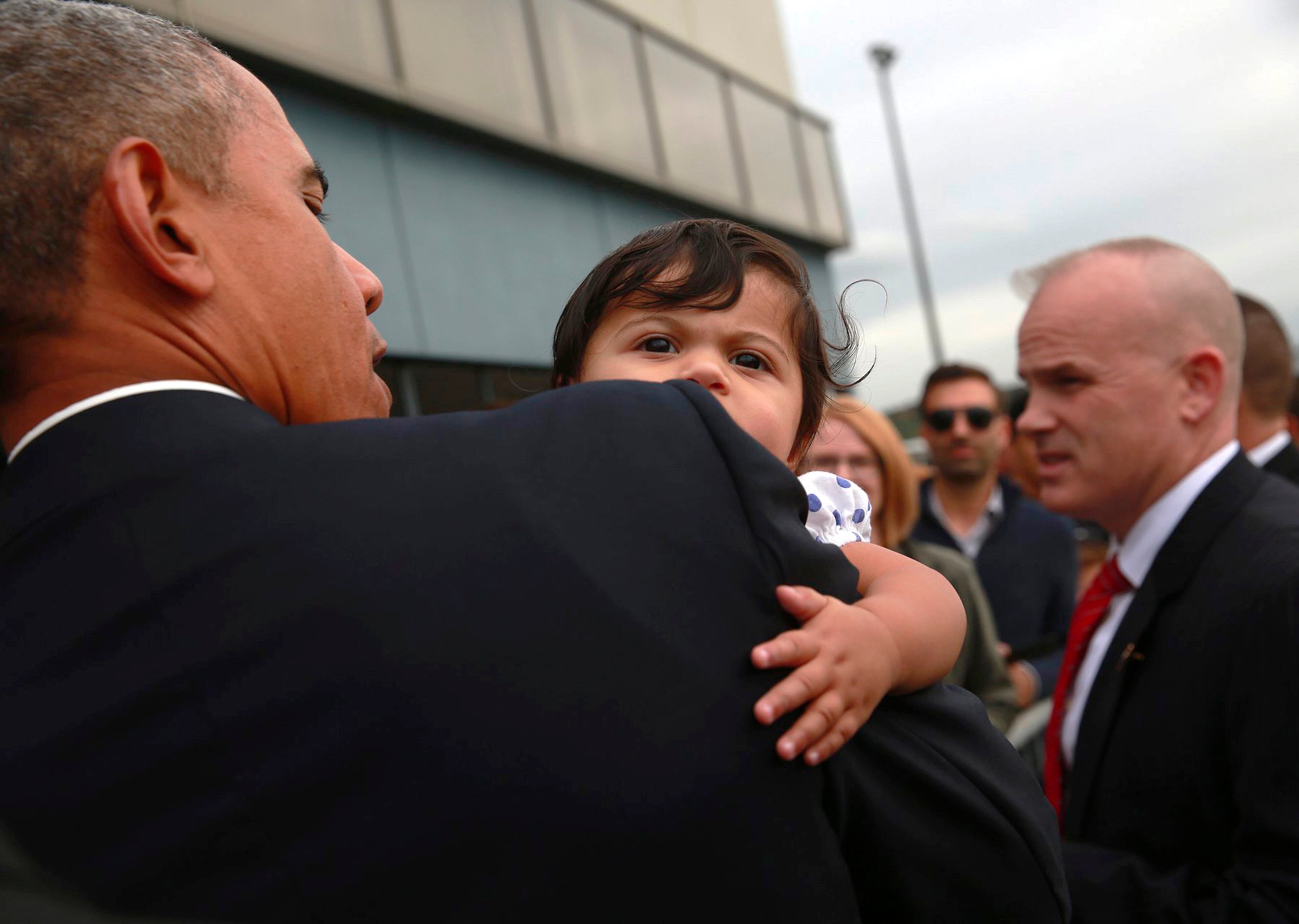 President Obama meets baby Stella Hakam during his arrival at King County International Airport/Boeing Field in Seattle on Friday, Oct. 9, 2015. (Erika Schultz/The Seattle Times via AP, Pool)