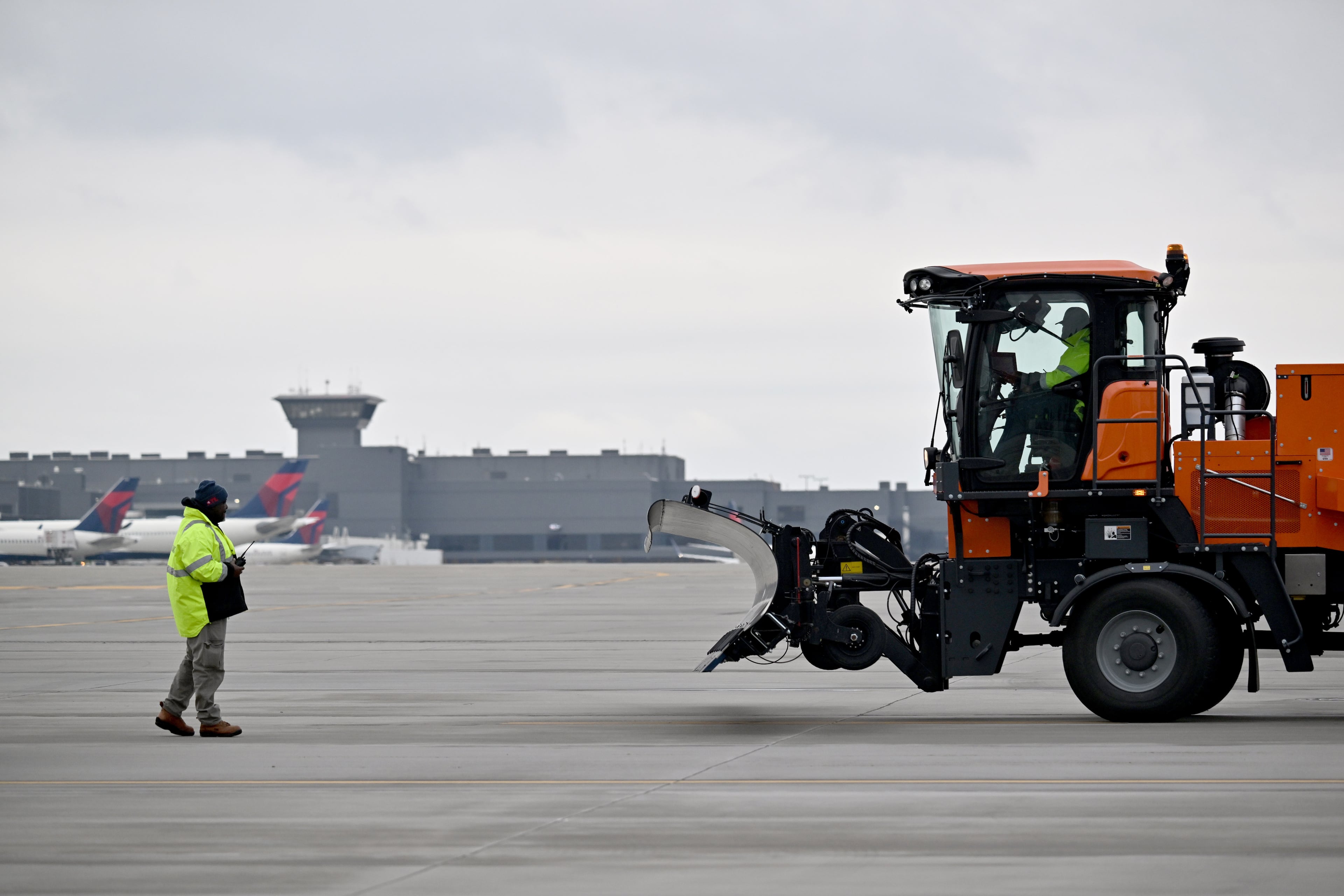 New pieces of machinery, which crews at Hartsfield-Jackson began testing and practicing with in December, allows the airport to remove ice and snow from the runways and taxiways more efficiently than previous equipment. (Hyosub Shin/AJC)