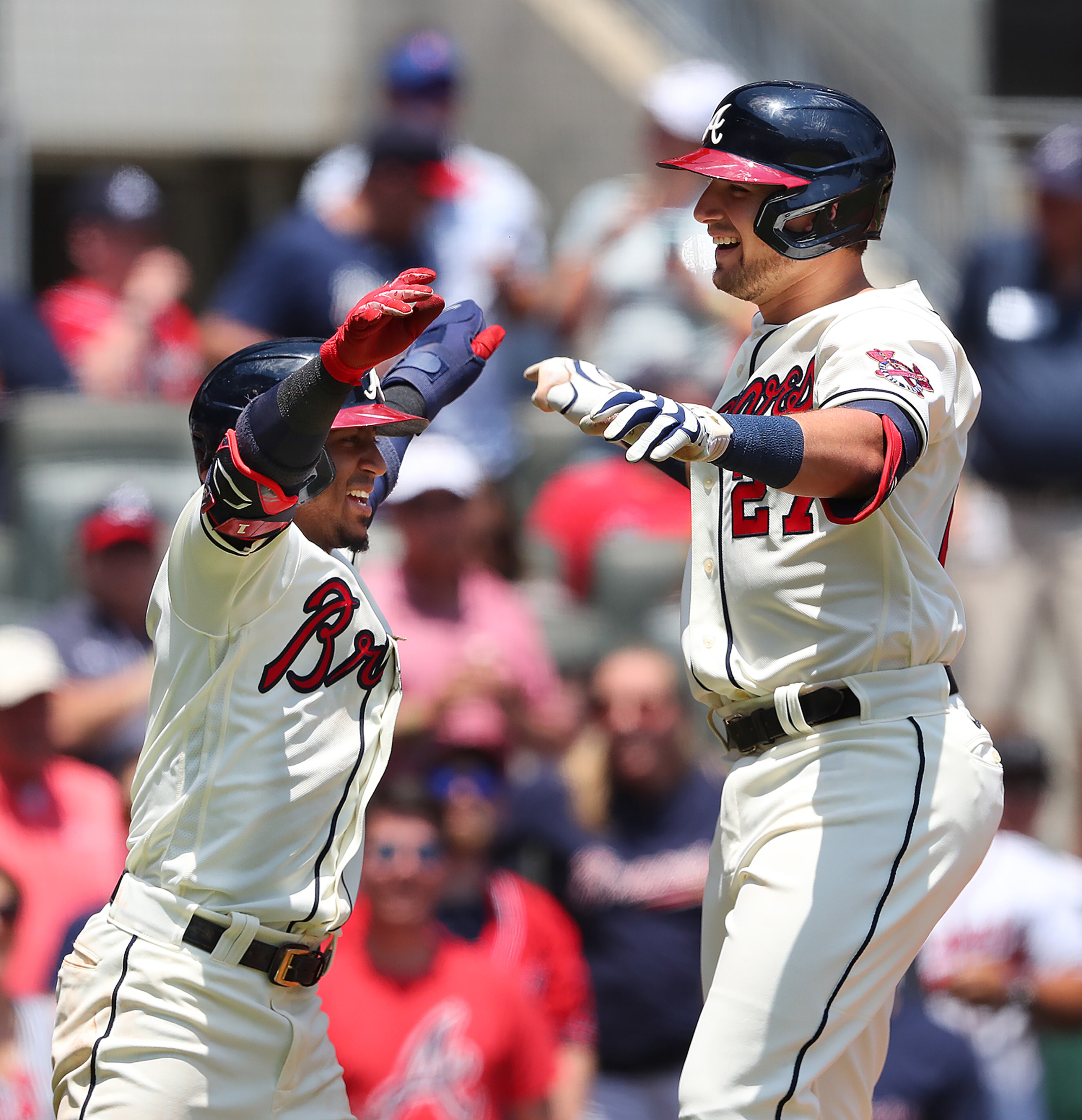 Braves third baseman Austin Riley (right) celebrates with teammate Ozzie Albies (left) after hitting his second home run of the game - in consecutive at-bats - against the Pittsburgh Pirates during the third inning Sunday, May 23, 2021, at Truist Park in Atlanta. (Curtis Compton / Curtis.Compton@ajc.com)