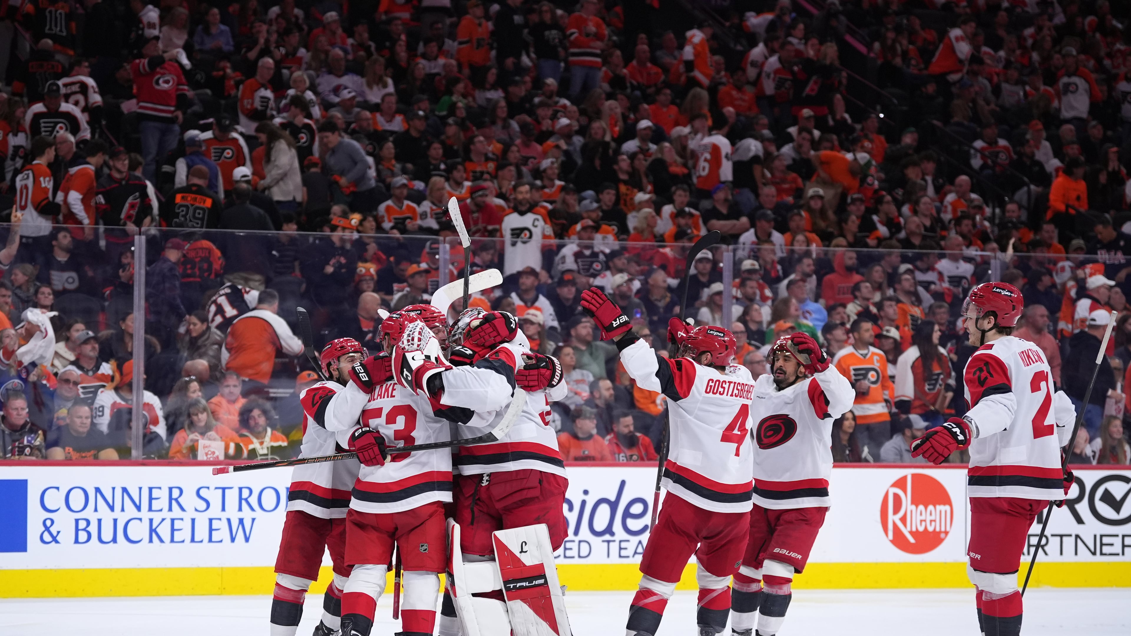 Carolina Hurricanes' players celebrate after winning Game 4 against the Philadelphia Flyers in a second-round NHL hockey Stanley Cup playoff series Saturday, May 9, 2026, in Philadelphia. (AP Photo/Matt Slocum)