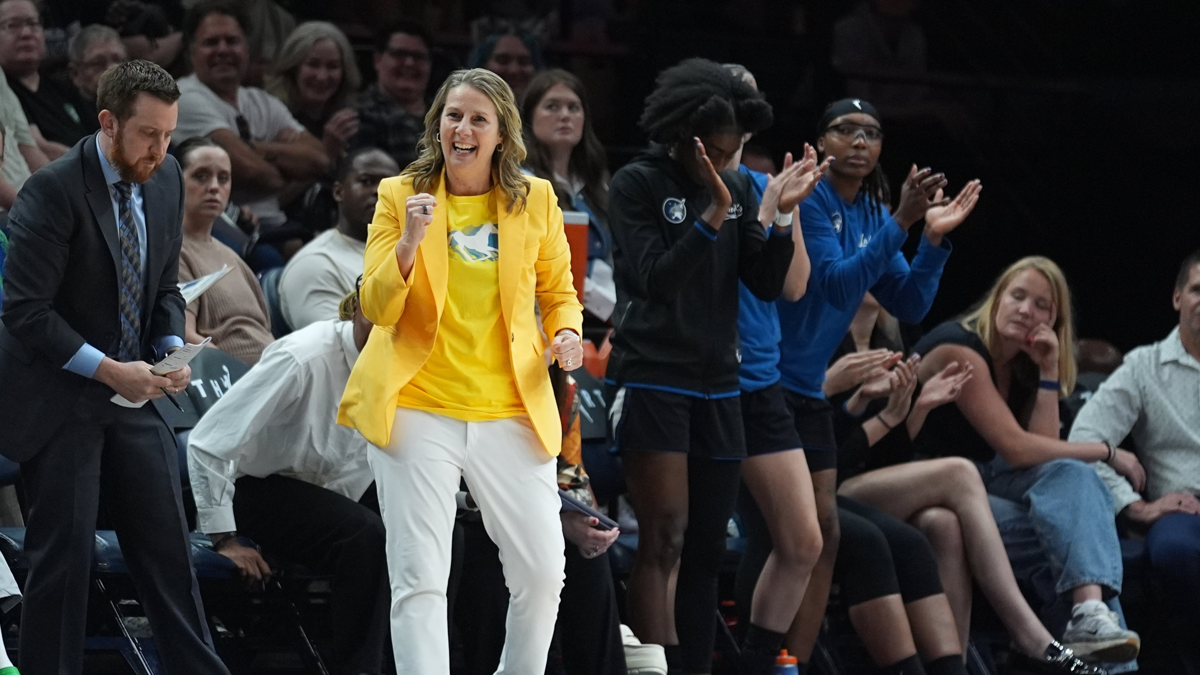Minnesota Lynx head coach Cheryl Reeve, middle, celebrates during the second half of a WNBA basketball game against the Atlanta Dream Wednesday, May 27, 2026, in Minneapolis. (AP Photo/Abbie Parr)