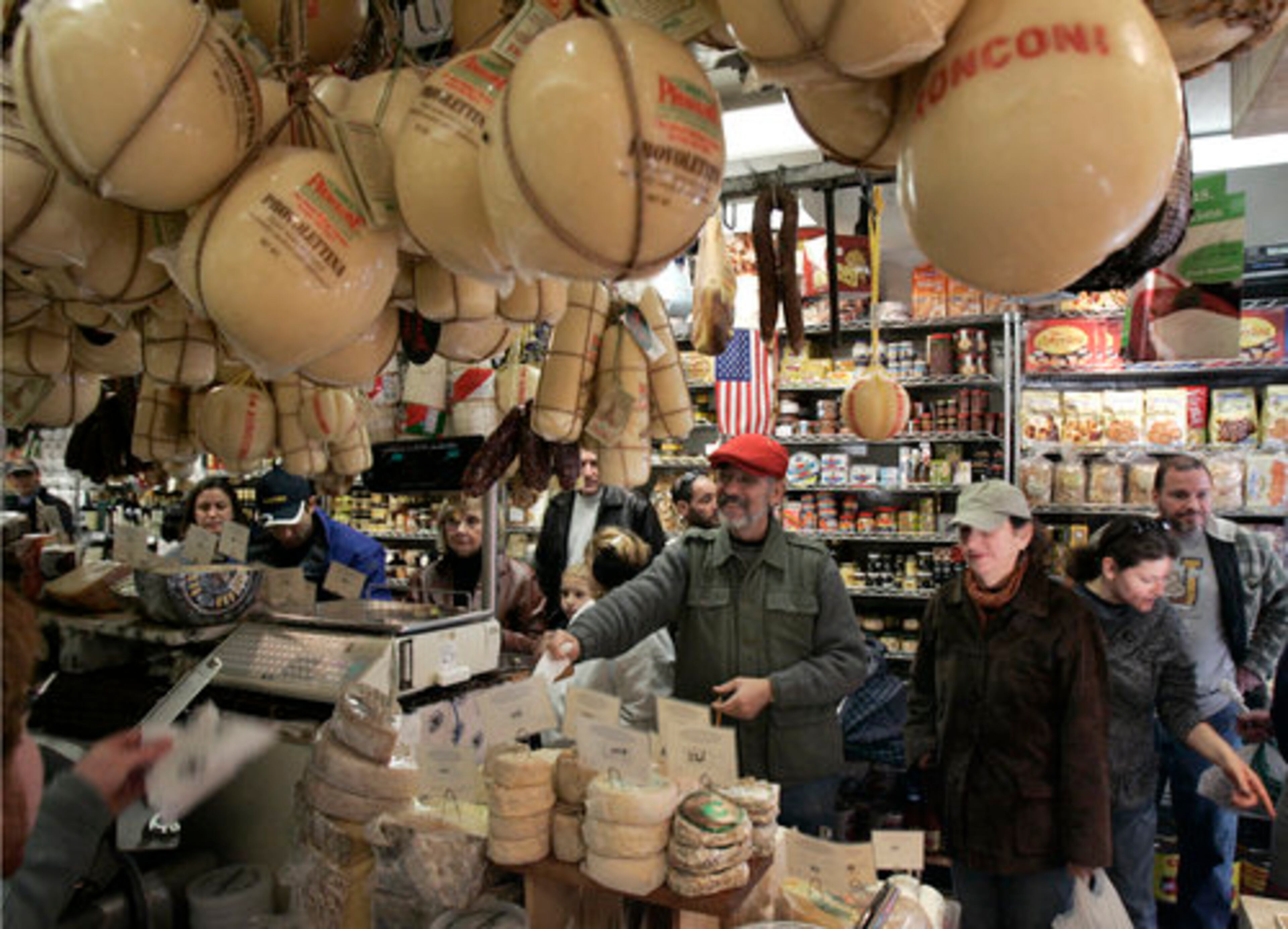 CUSTOMERS LINE up to be served at Di Bruno Bros. in Philadelphia's Italian market.