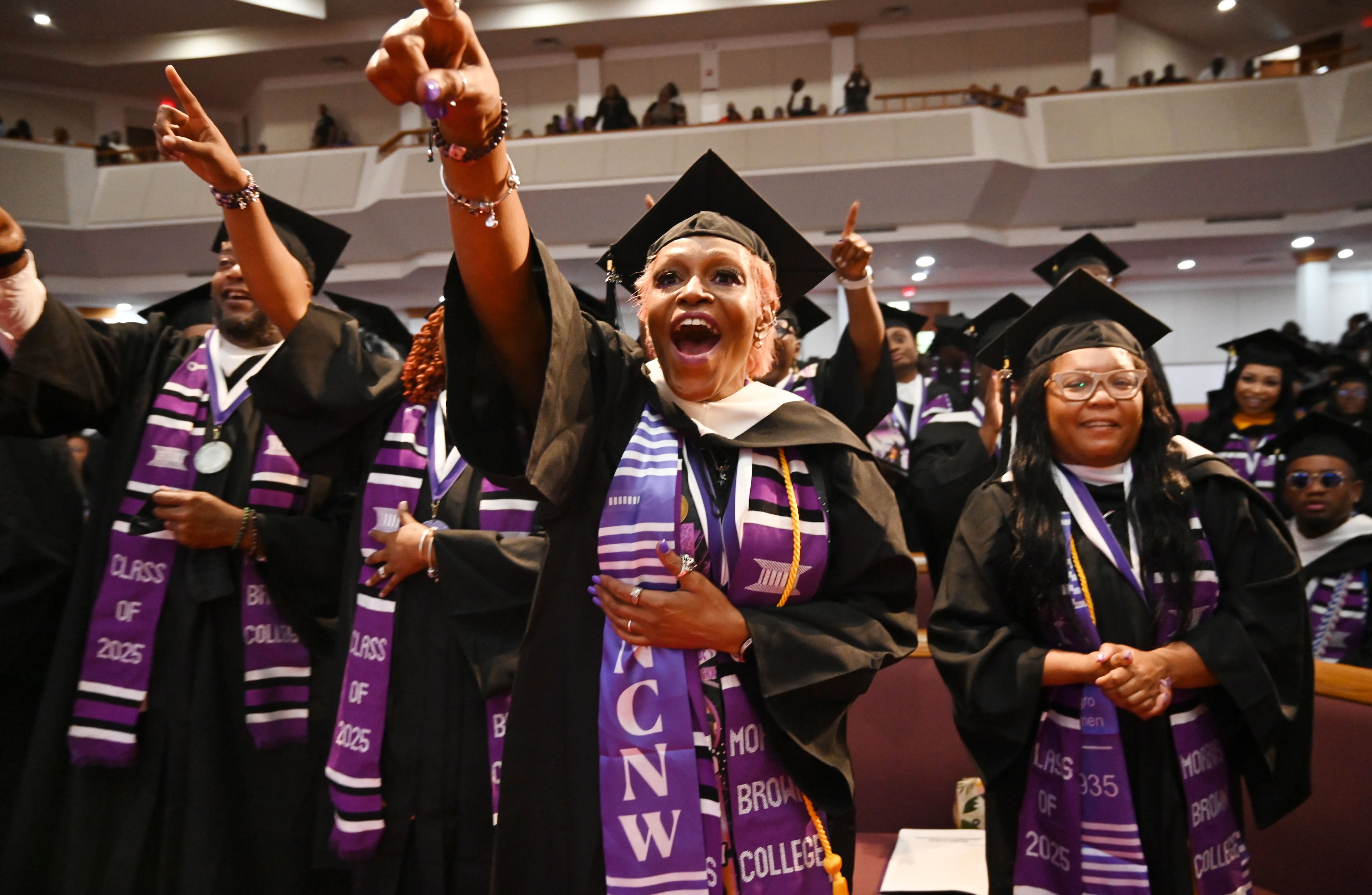 Graduates react as Bishop T.D. Jakes delivers the commencement address during 2025 Morris Brown College commencement exercises at Saint Philip A.M.E. Church, Saturday, May 17, 2025, in Atlanta. (Hyosub Shin / AJC)