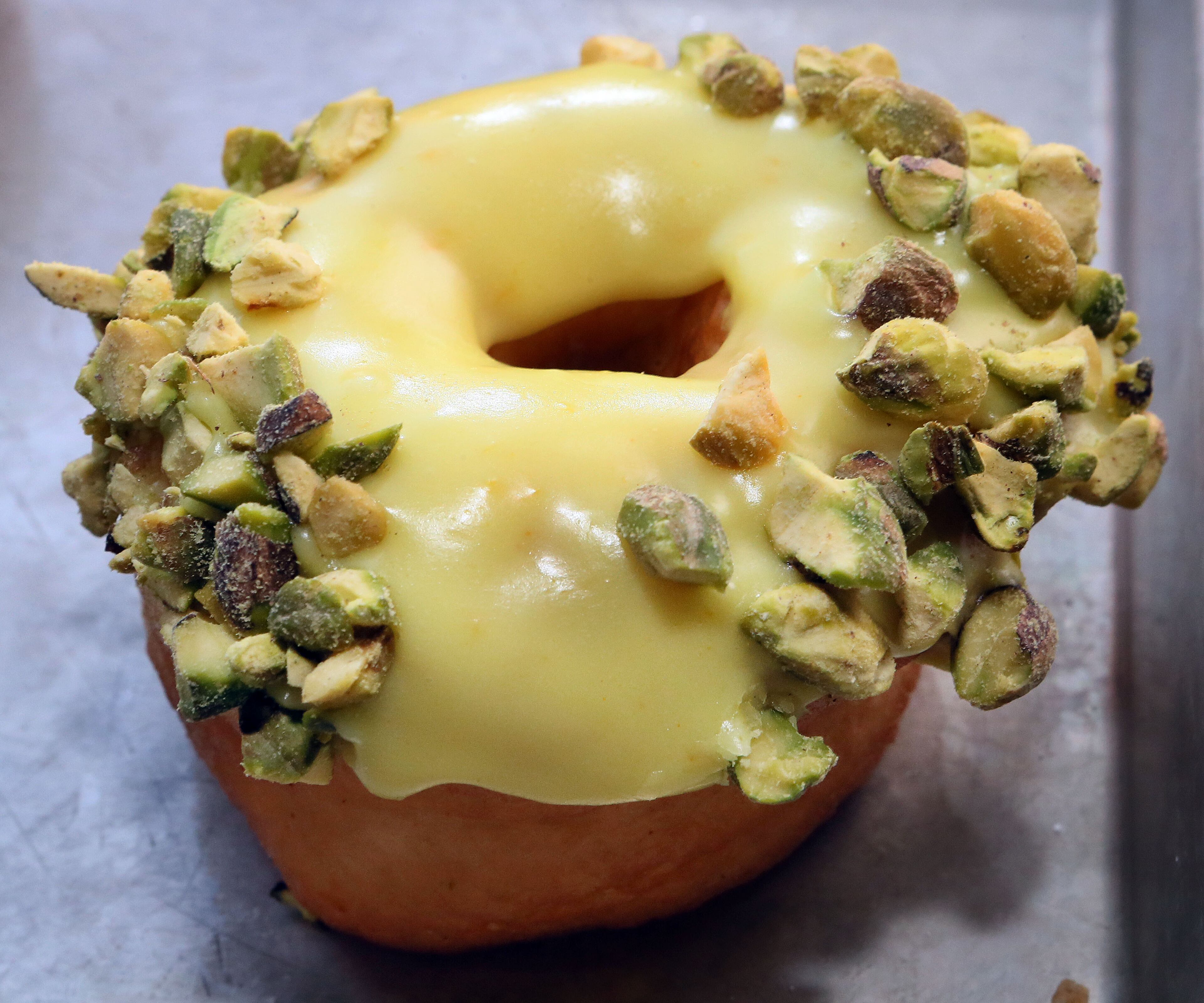 A vegan Orange Pistachio doughnut from Revolution Doughnuts