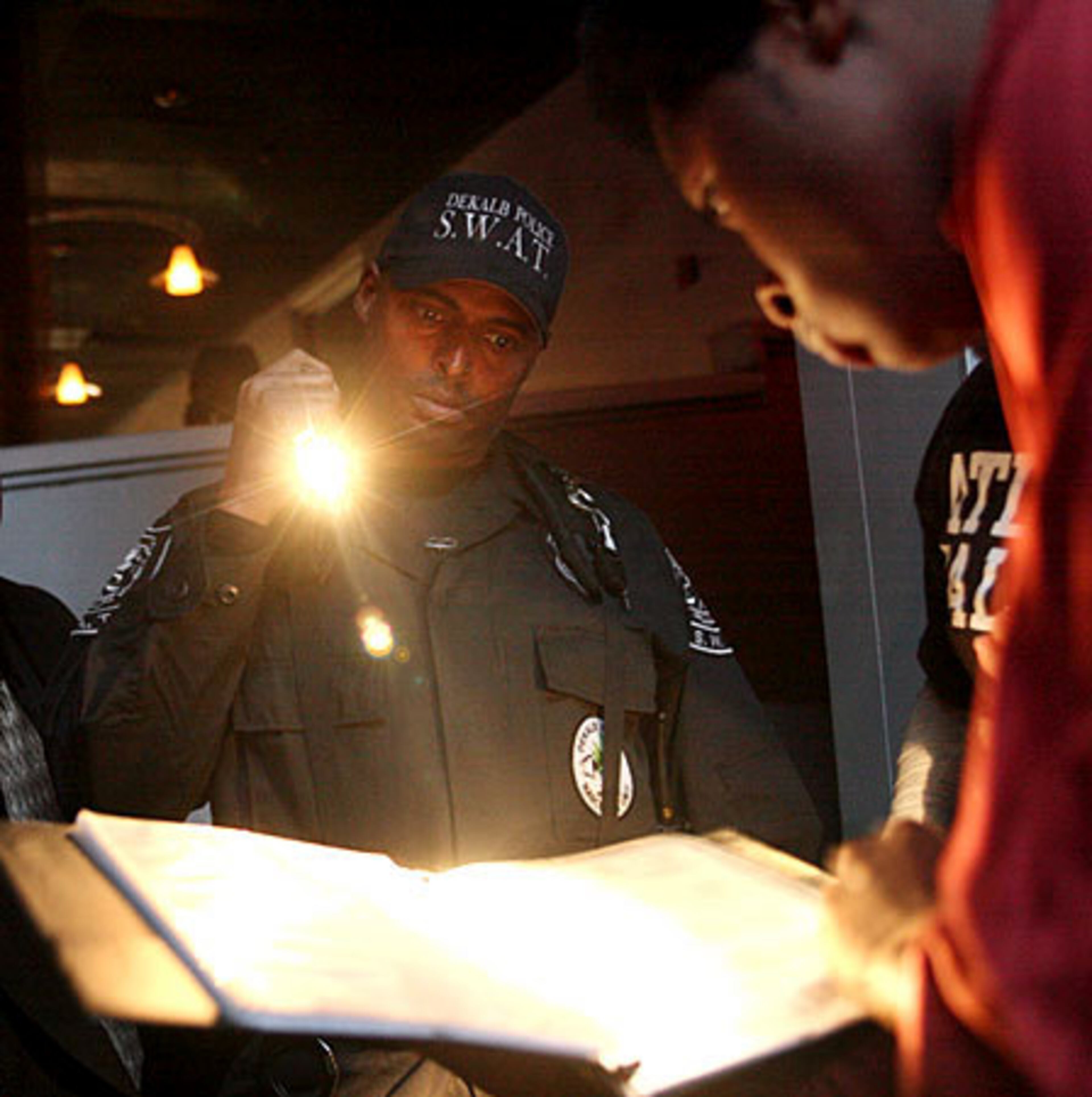 Detective J. Conley helps a Studio 72 manager find a permit for a bouncer. Except for kitchen staff, every employee must have a permit obtained from the county to work in nightclubs. Police much check each employee individually for their permit.