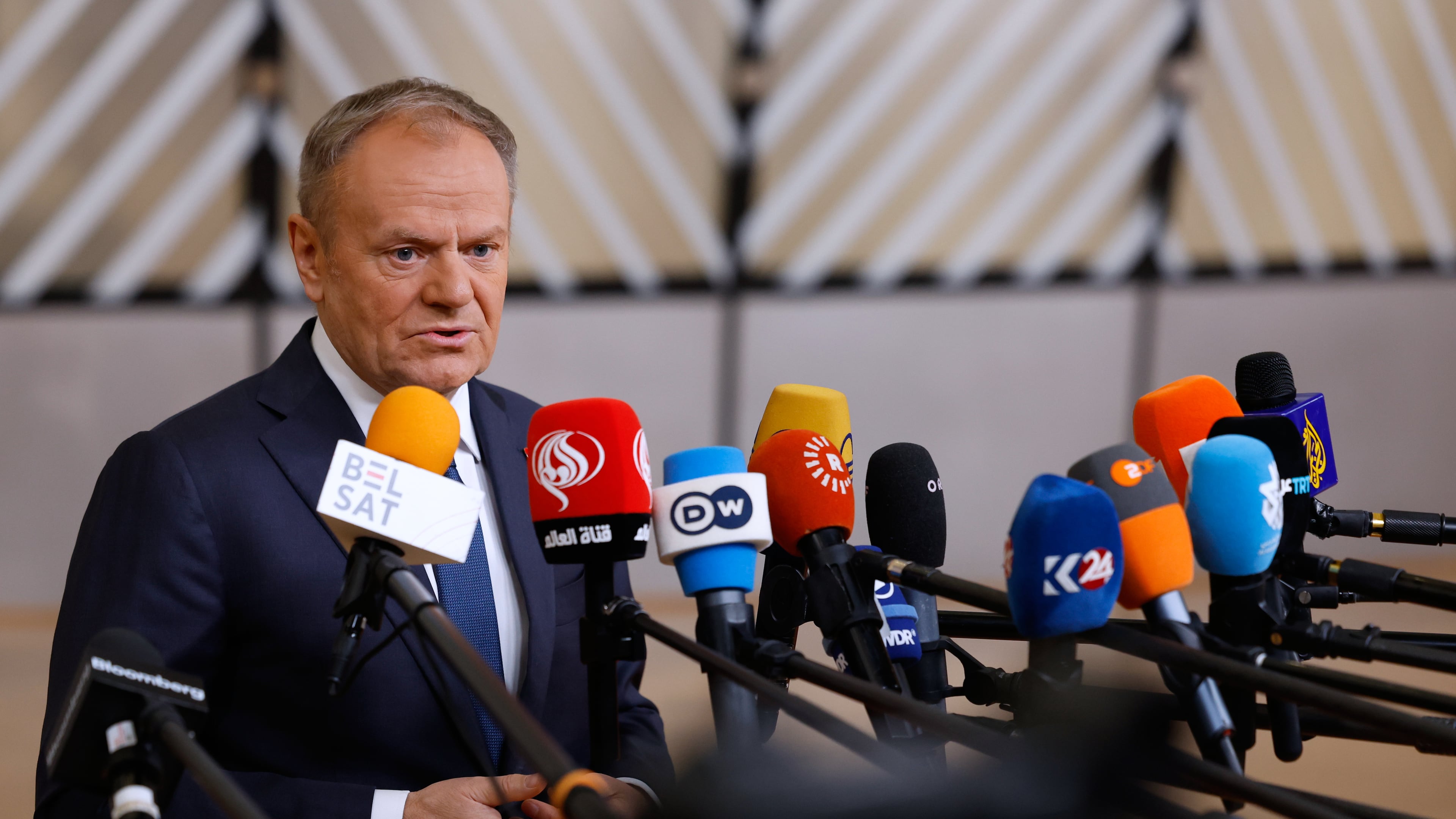 FILE - Poland's Prime Minister Donald Tusk speaks with the media as he arrives for the EU Summit in Brussels, Thursday, Dec. 18, 2025. (AP Photo/Geert Vanden Wijngaert, file)