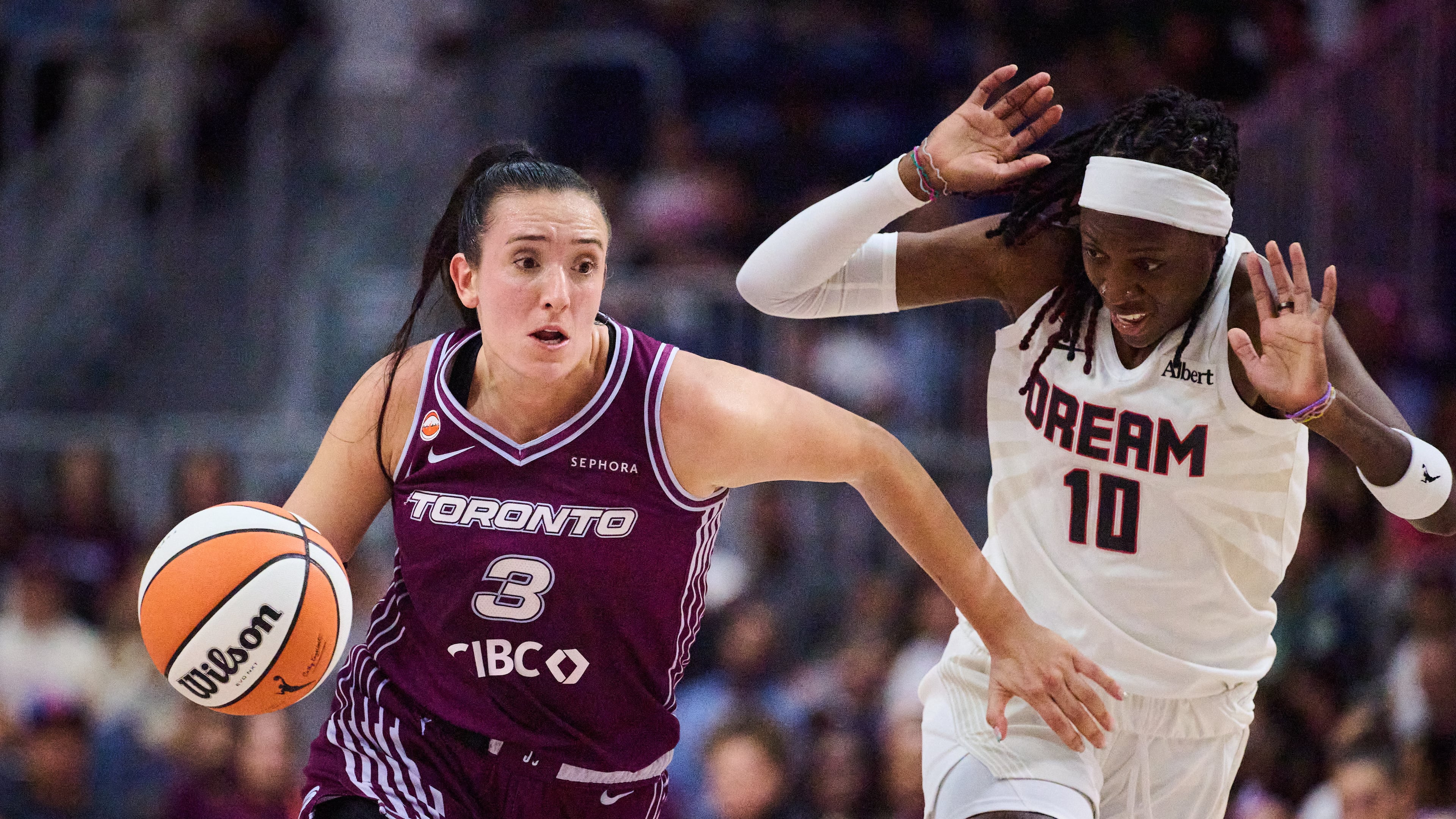 Toronto Tempo's Marina Mabrey (3) drives past Atlanta Dream's Rhyne Howard (10) during first half of a WNBA basketball game in Toronto, Friday, July 17, 2026. (Sammy Kogan/The Canadian Press via AP)