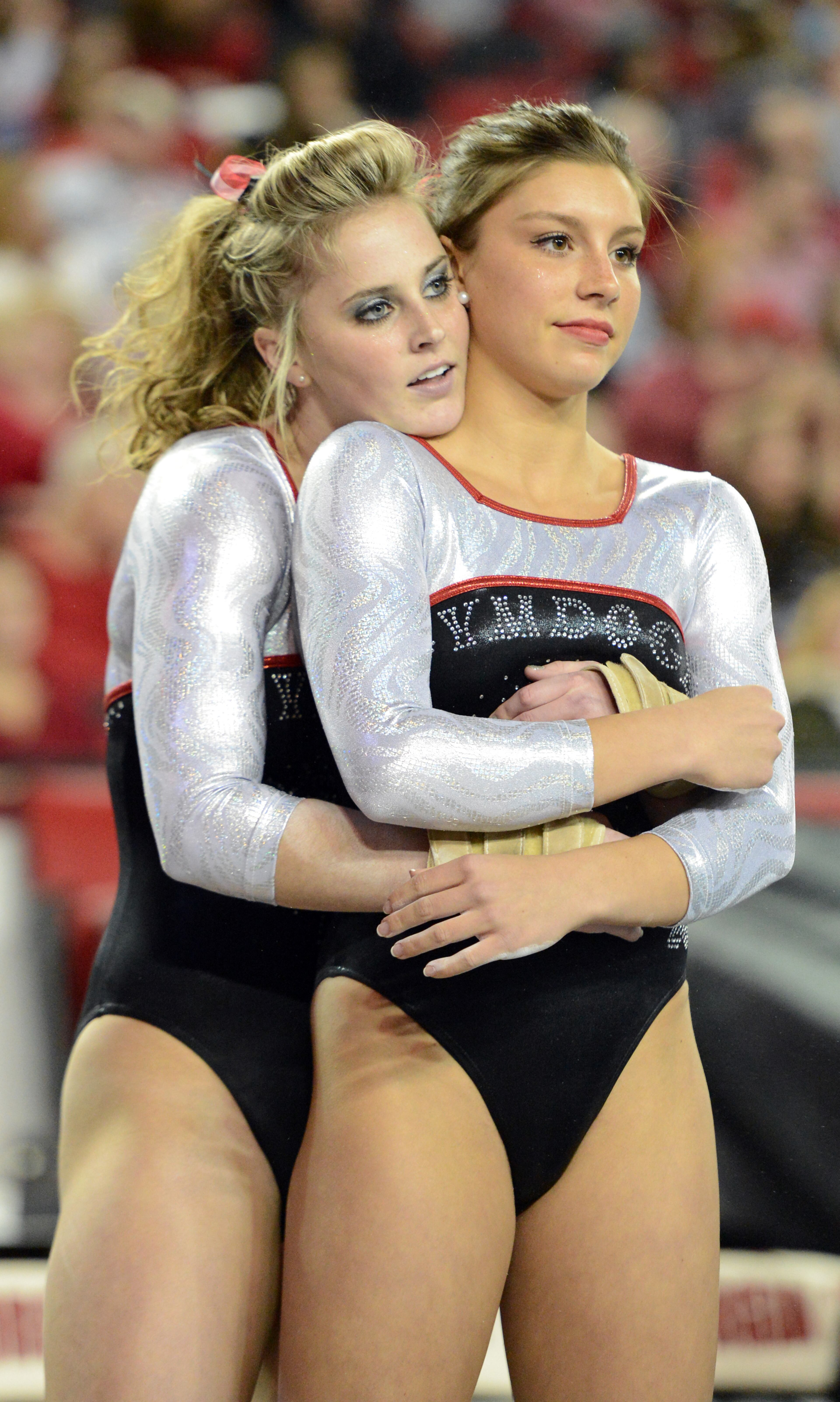 January 5, 2013 Athens - Georgia Gym Dog Shayla Worley (left) comforts Sarah Persinger as Sarah waits to compete on the floor against University of Oklahoma at Stegeman Coliseum in Athens on Saturday, Jan. 5, 2013. HYOSUB SHIN / HSHIN@AJC.COM