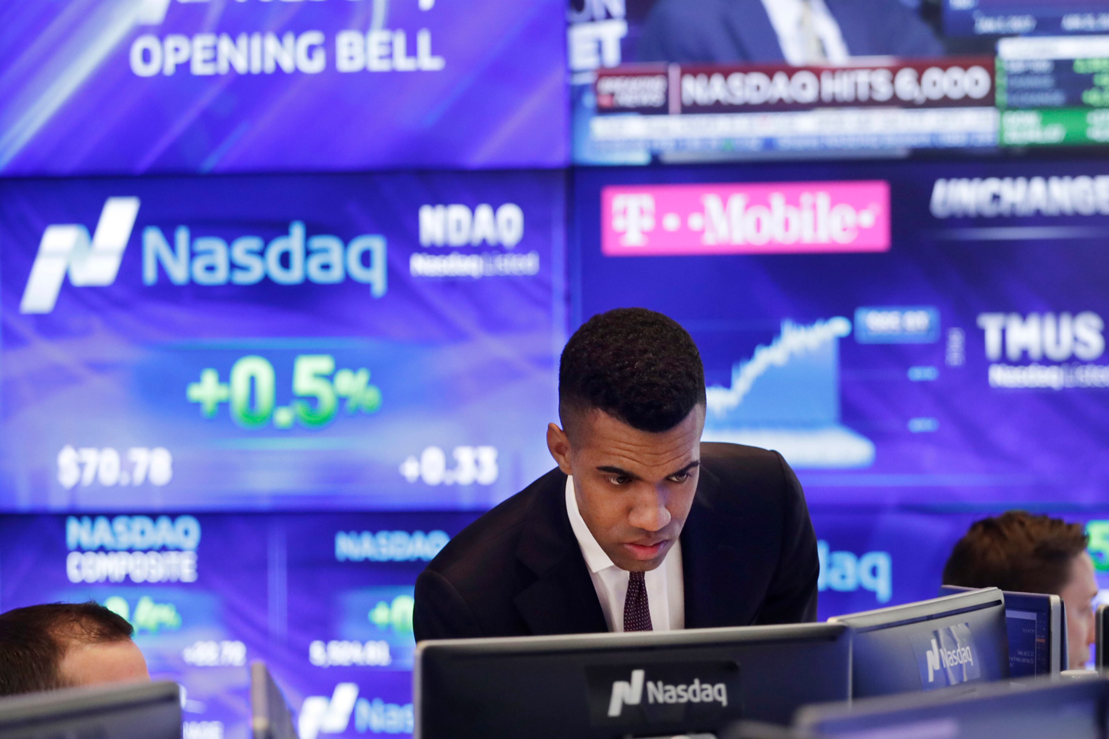 Brad Smith monitors stock prices at the Nasdaq MarketSite, Tuesday, April 25, 2017, in New York. The Nasdaq Composite rose above 6,000 Tuesday, a record high. (AP Photo/Mark Lennihan)